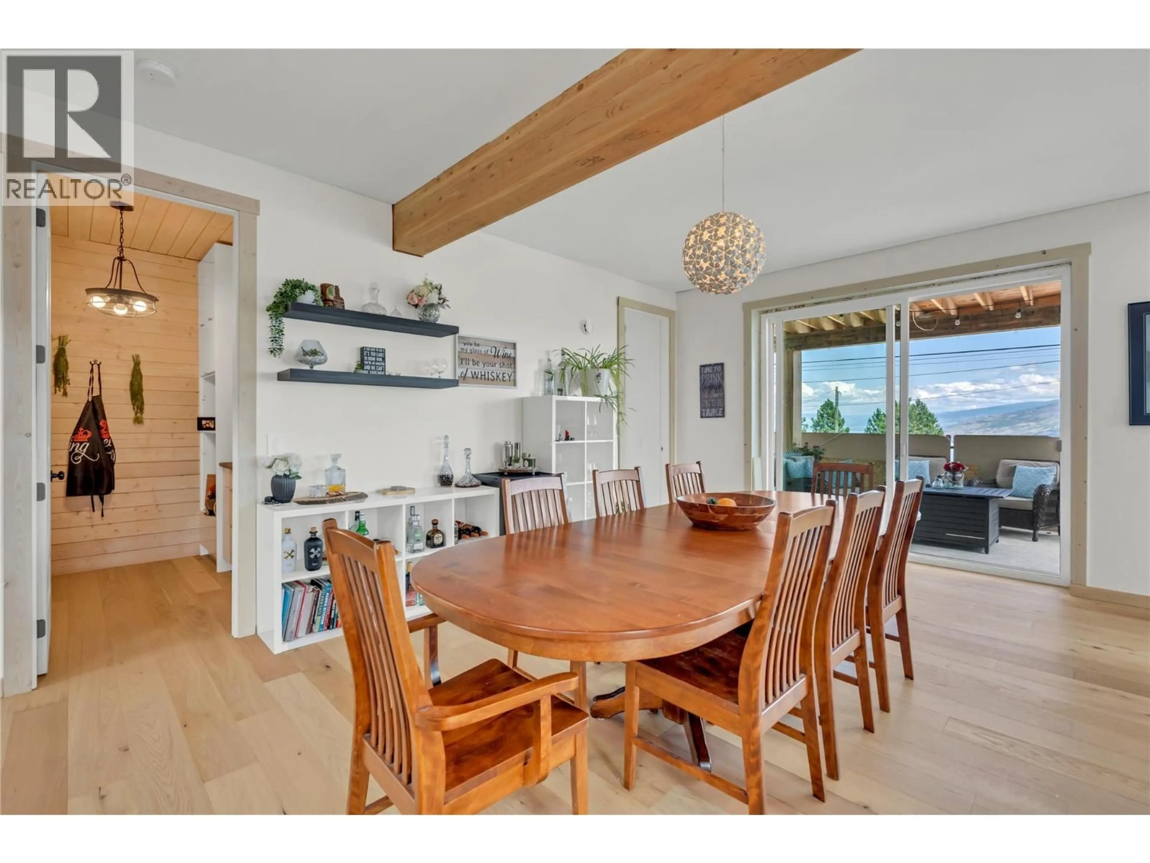 Dining room, wood/laminate floor for 6074 JACKSON CRESCENT, Peachland British Columbia V0H1X4