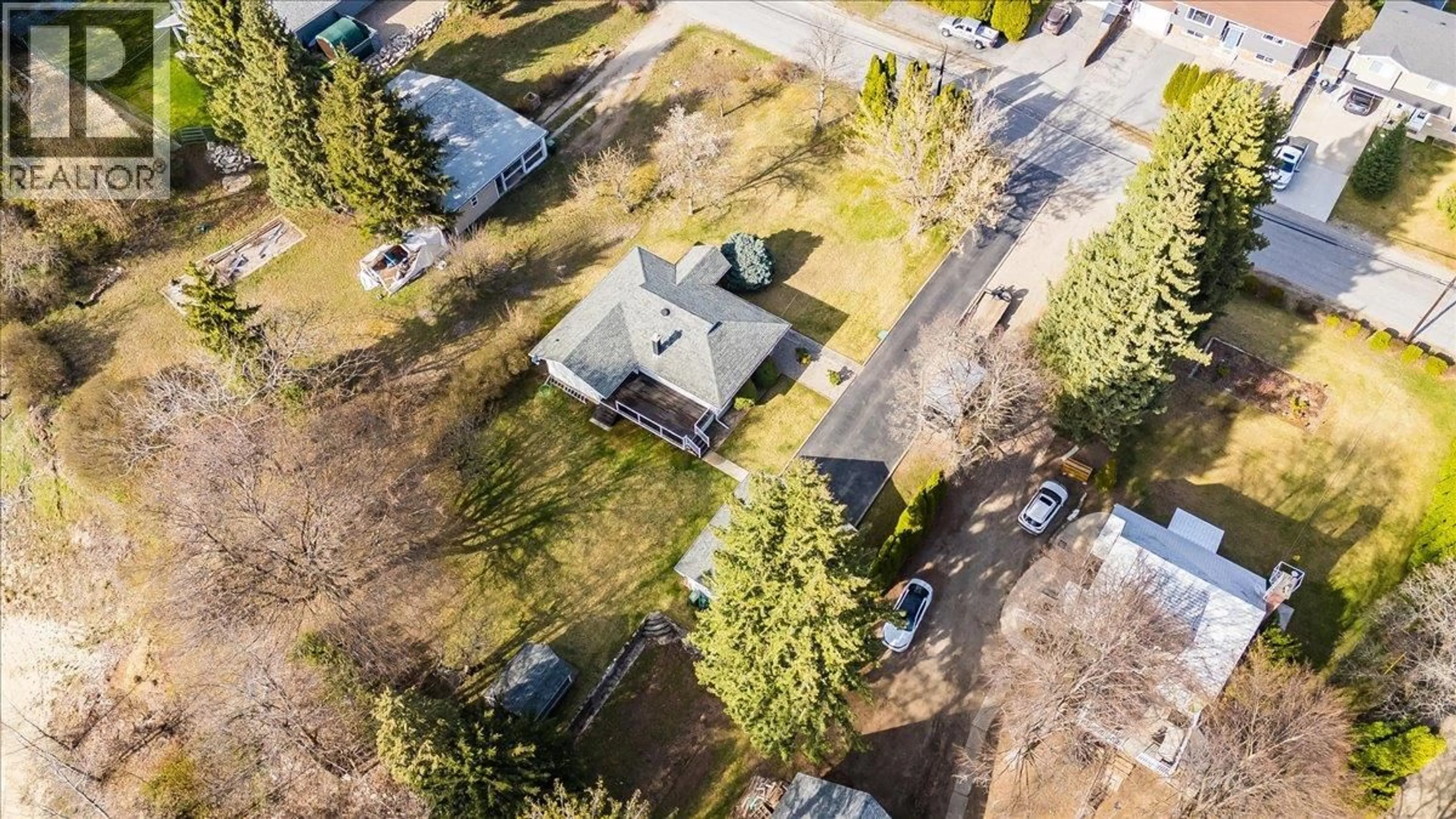 A pic from outside/outdoor area/front of a property/back of a property/a pic from drone, street for 112 100TH STREET, Castlegar British Columbia V1N3C5