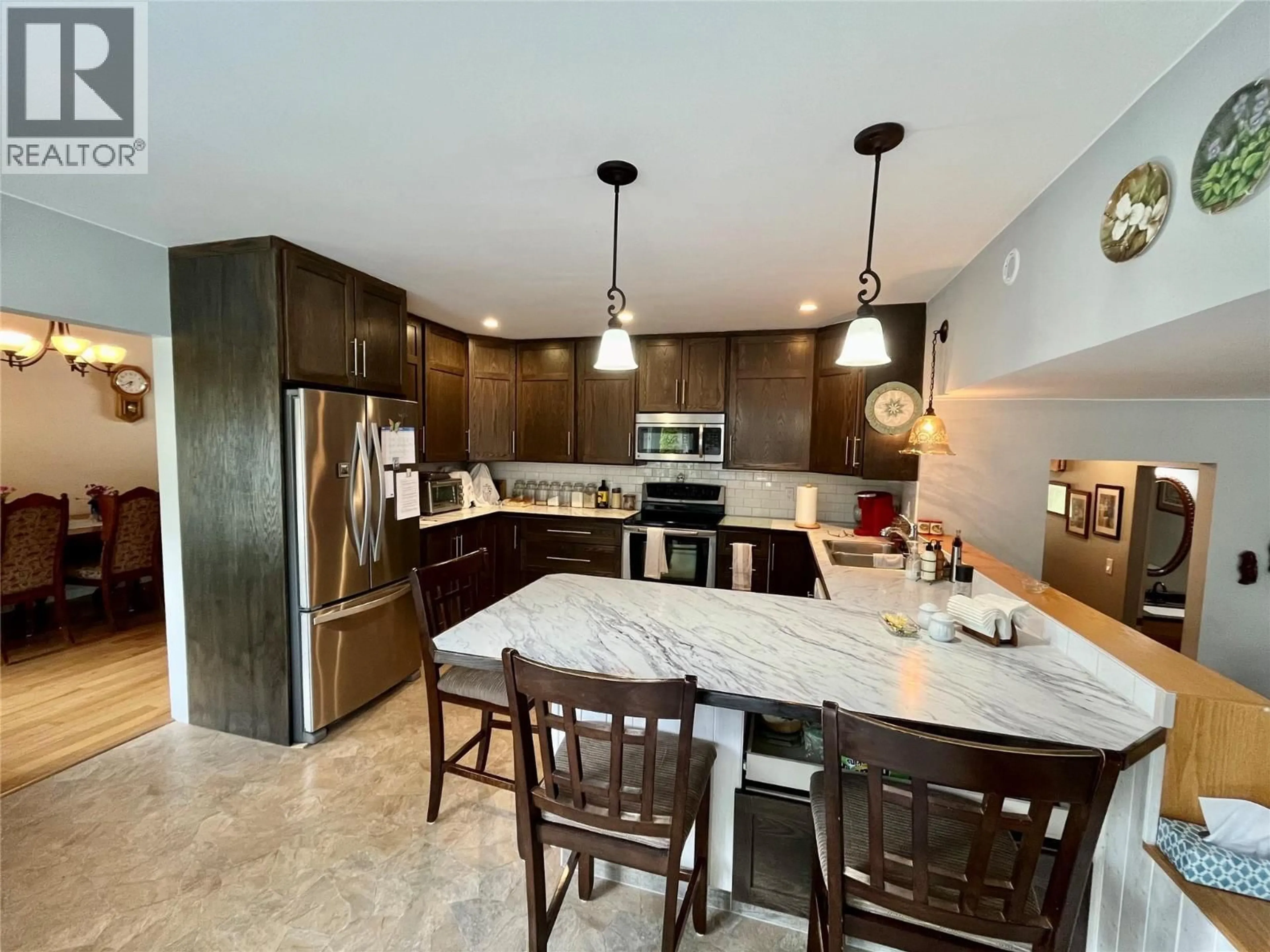 Open concept kitchen, ceramic/tile floor for 609 10TH AVENUE NORTHWEST, Nakusp British Columbia V0G1R0