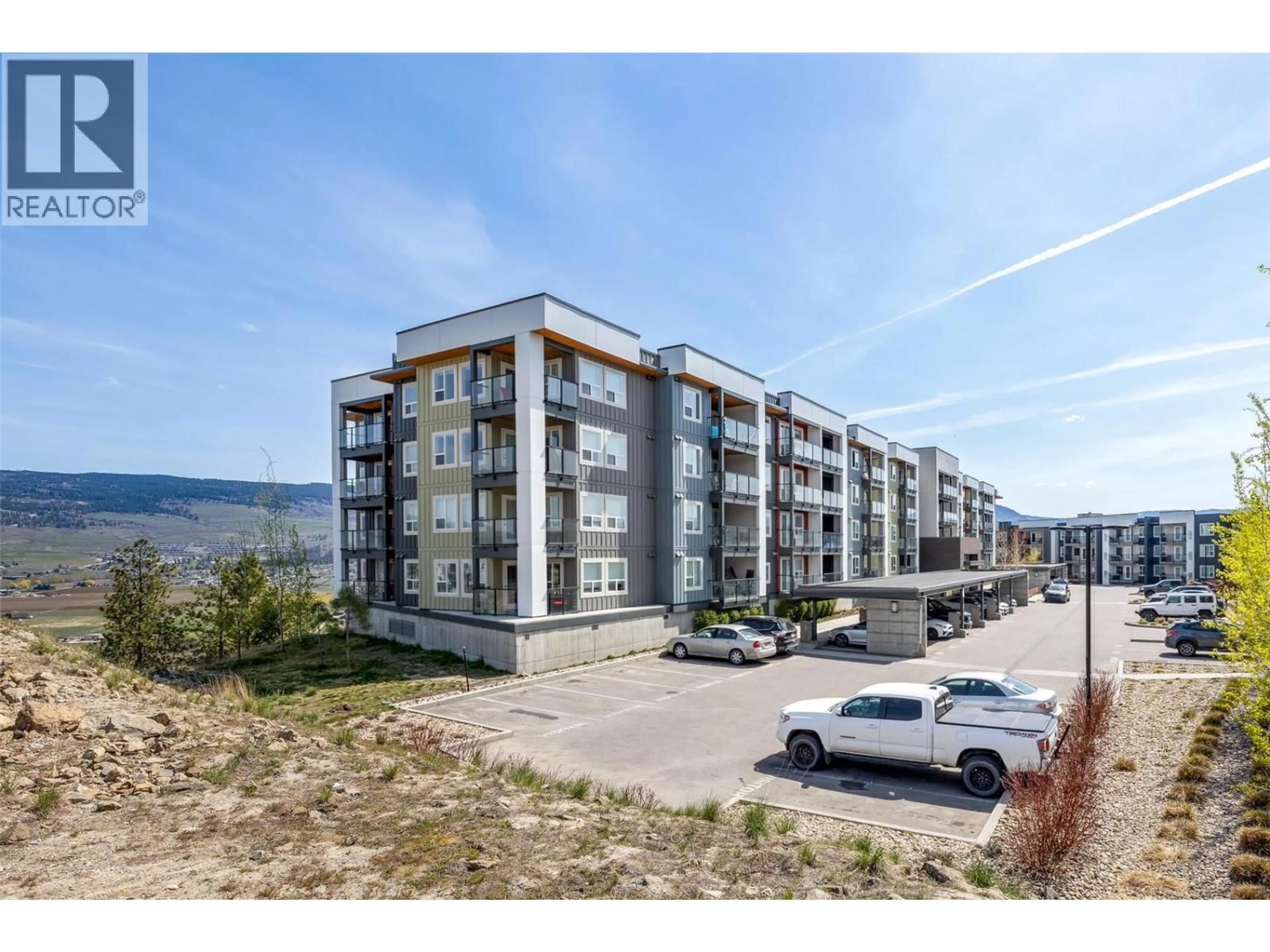 A pic from outside/outdoor area/front of a property/back of a property/a pic from drone, water/lake/river/ocean view for 301 - 775 ACADEMY WAY, Kelowna British Columbia V1V0A5