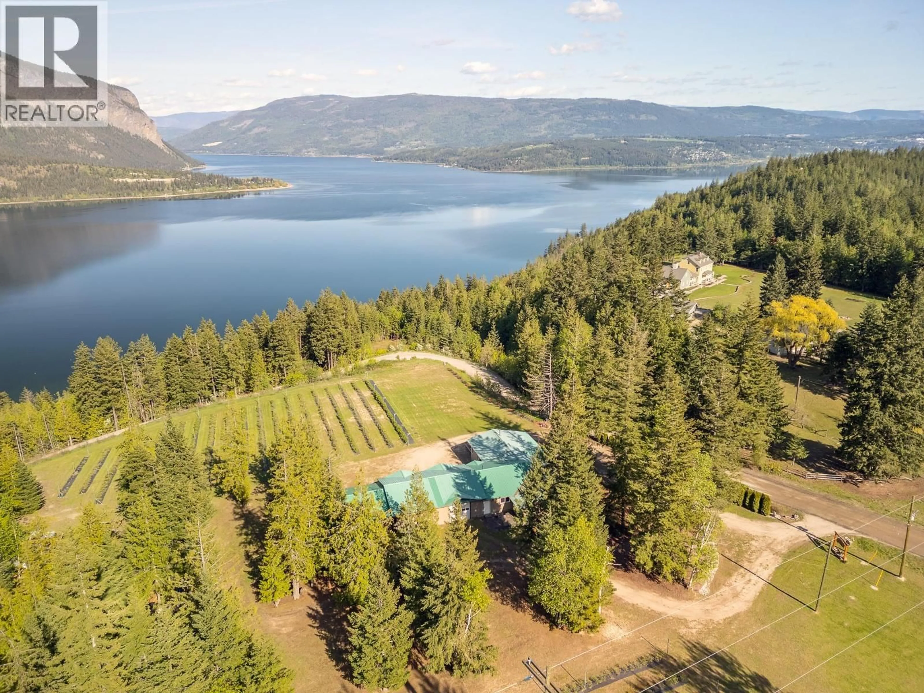 A pic from outside/outdoor area/front of a property/back of a property/a pic from drone, water/lake/river/ocean view for 285 KAULT HILL ROAD, Salmon Arm British Columbia V1E3A4