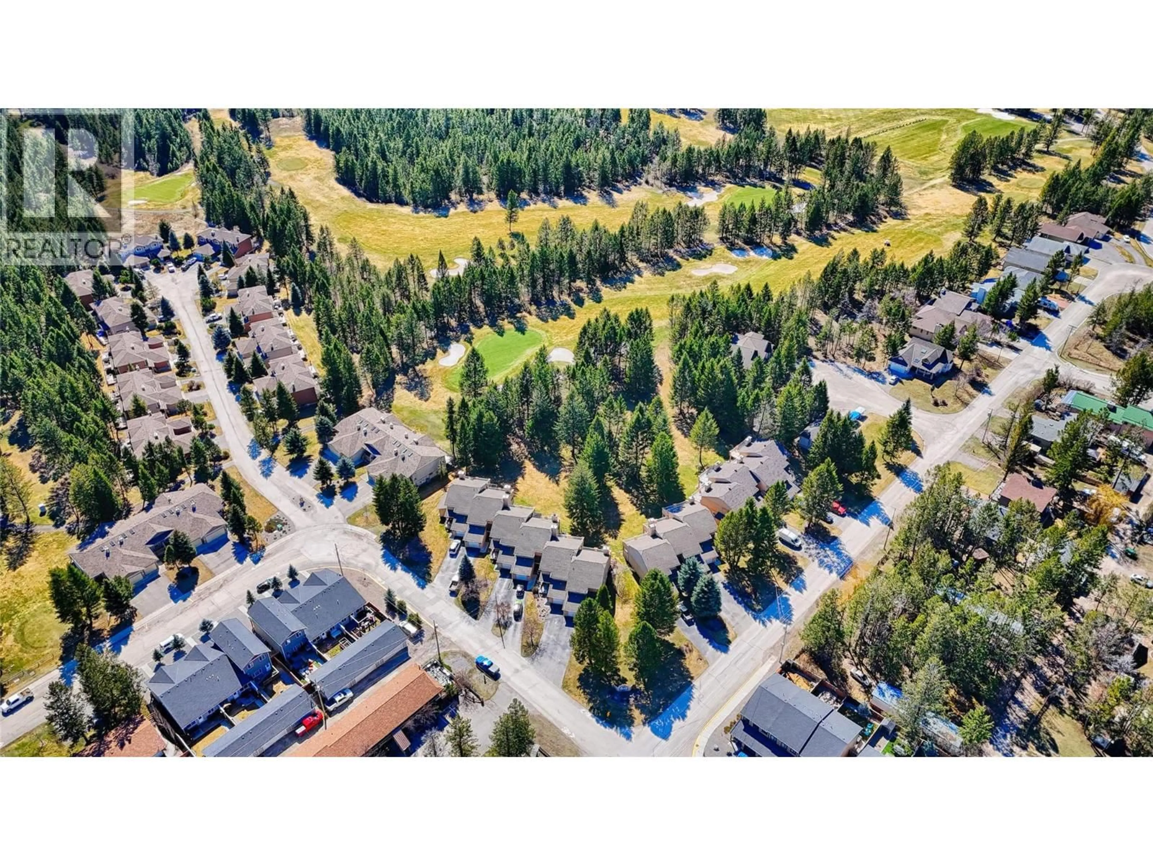 A pic from outside/outdoor area/front of a property/back of a property/a pic from drone, street for 8 - 7595 PIONEER AVENUE, Radium Hot Springs British Columbia V0A1M0