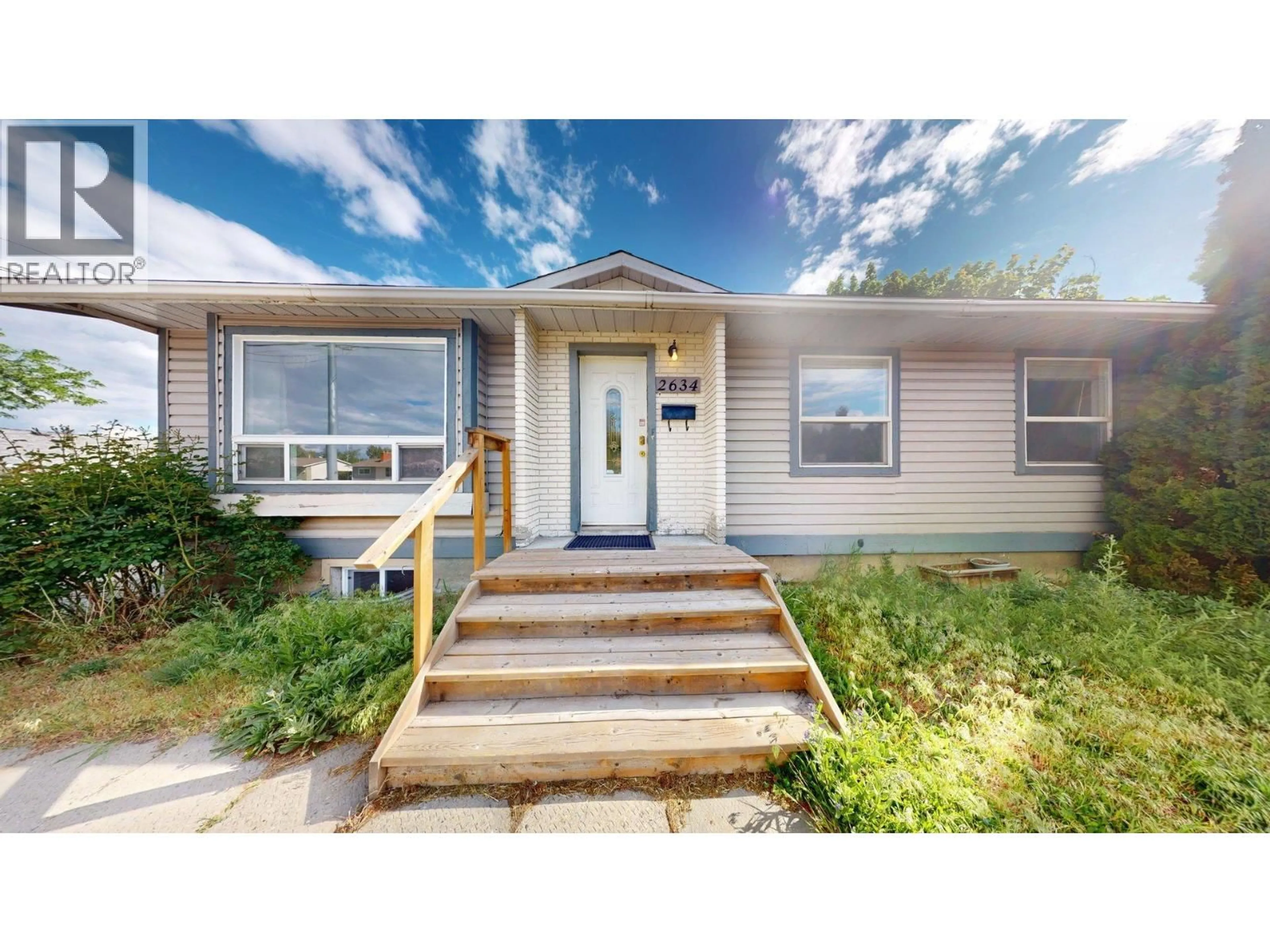 Home with vinyl exterior material, street for 2634 SPRINGFIELD ROAD, Kelowna British Columbia V1X1B8
