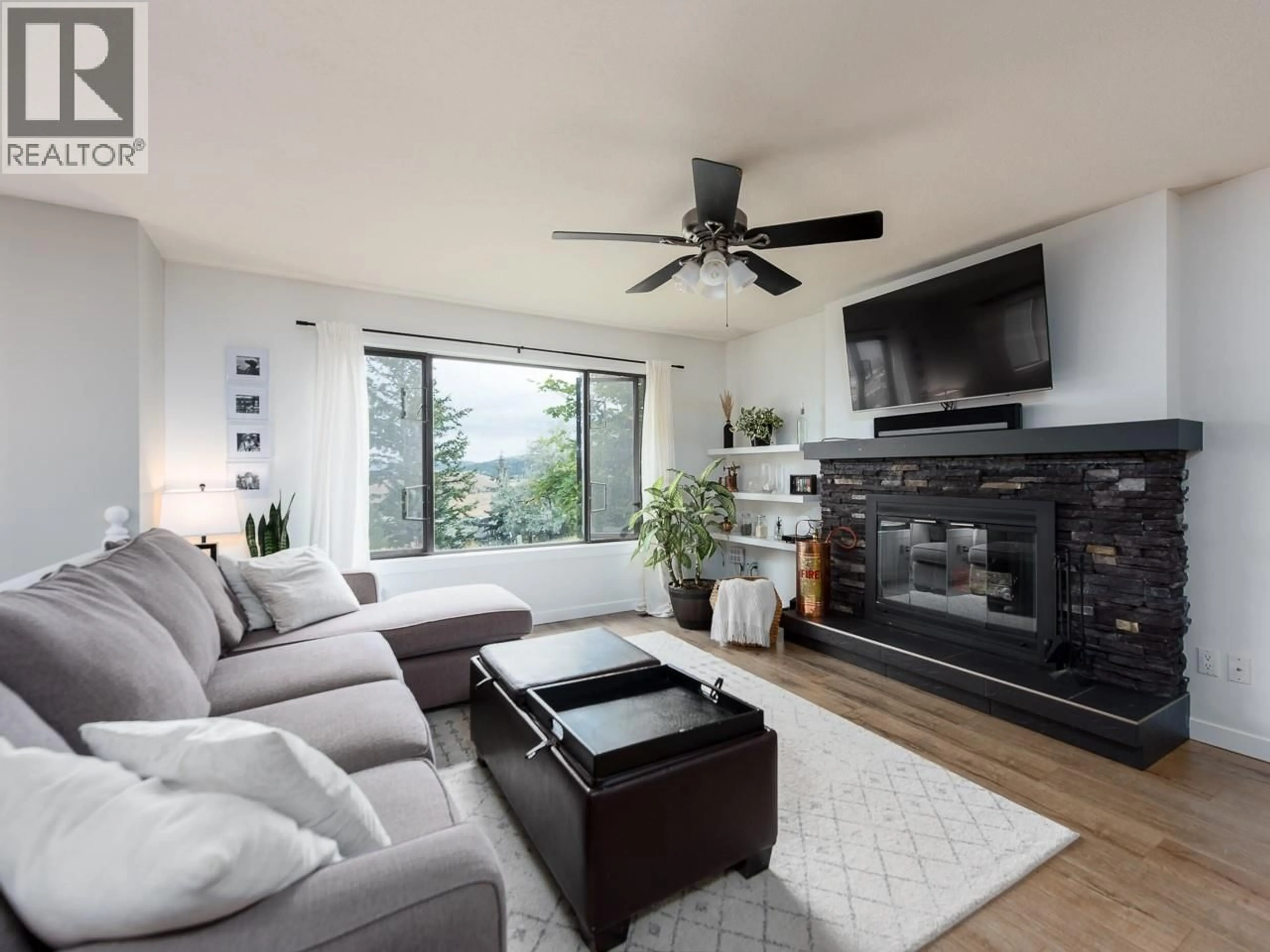 Living room with furniture, wood/laminate floor for 2180 SIFTON AVENUE, Kamloops British Columbia V1S1A5