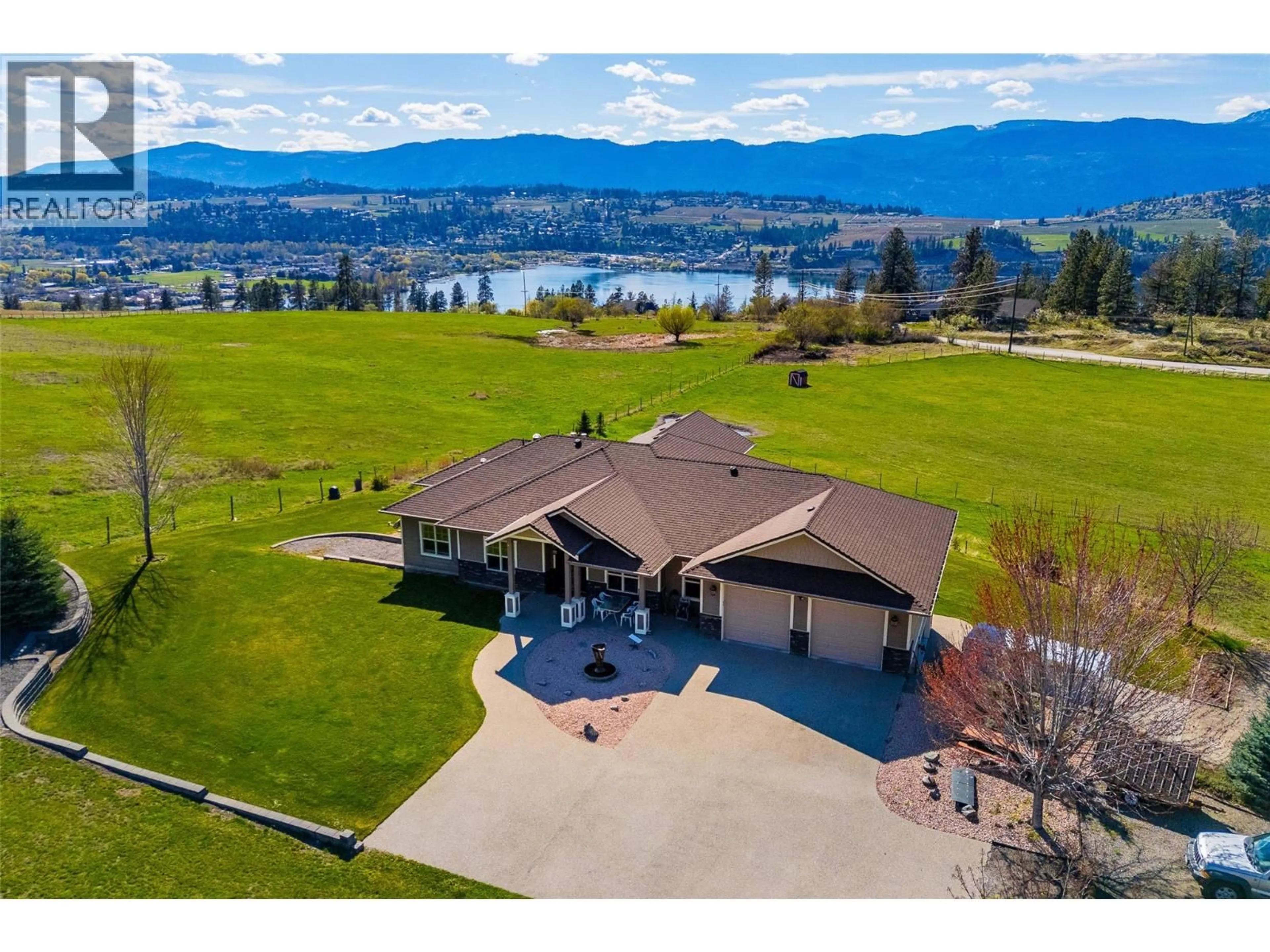 A pic from outside/outdoor area/front of a property/back of a property/a pic from drone, water/lake/river/ocean view for 12435 OYAMA ROAD, Lake Country British Columbia V4V2A4