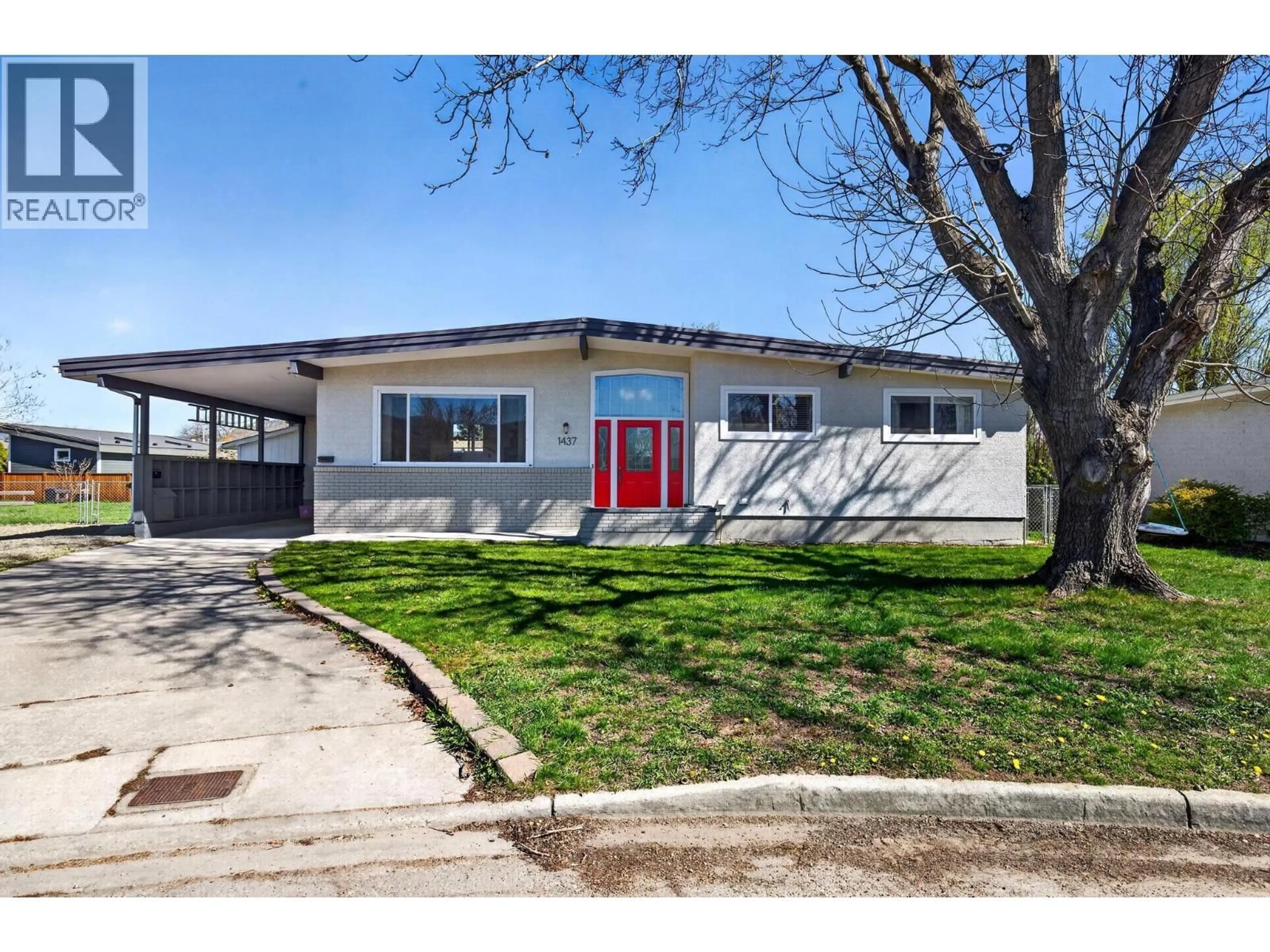 Home with vinyl exterior material, street for 1437 ASPEN COURT, Kelowna British Columbia V1Y3R3