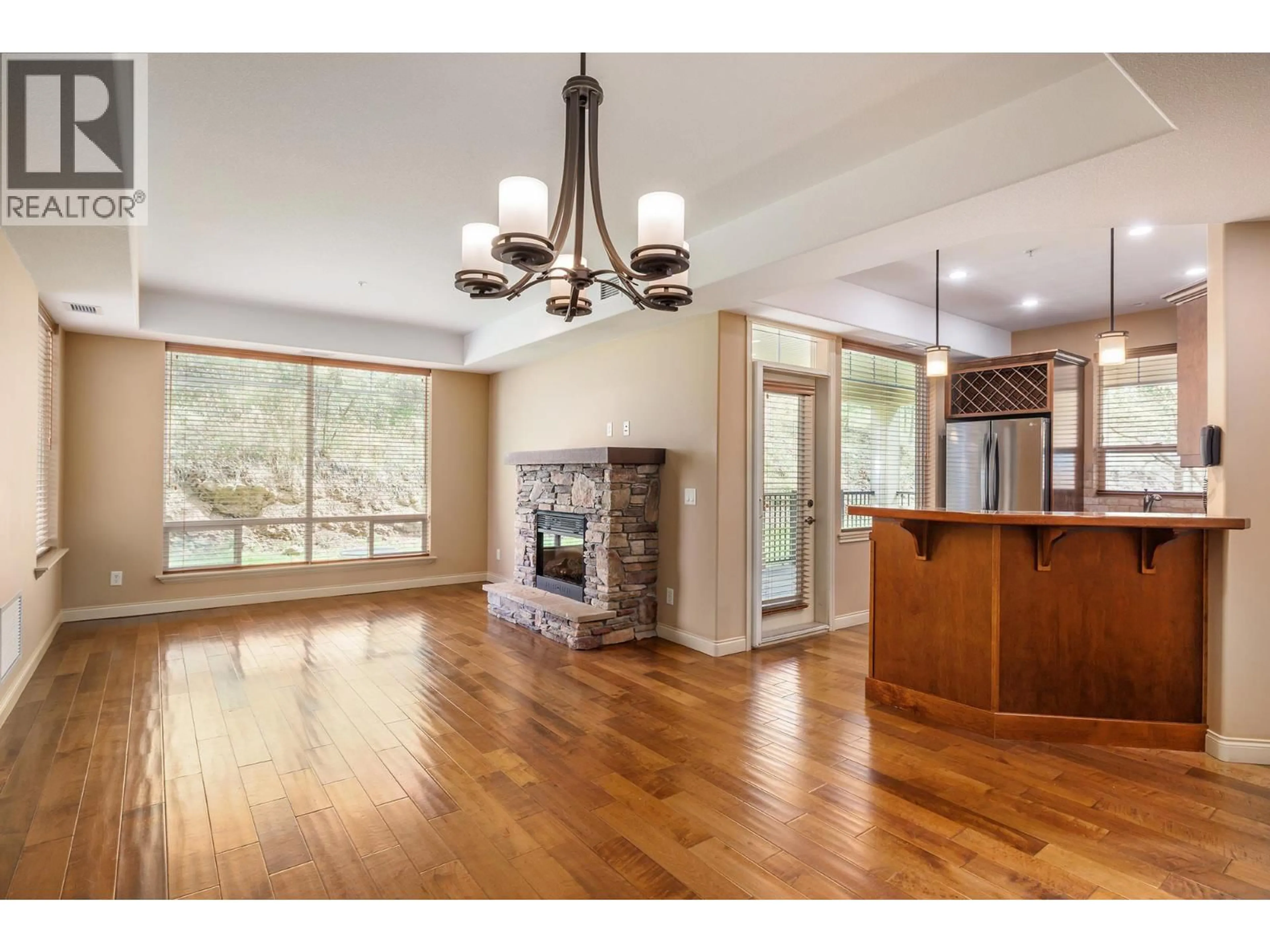 Open concept kitchen, wood/laminate floor for 109 - 2770 AUBURN ROAD, West Kelowna British Columbia V4T4C2