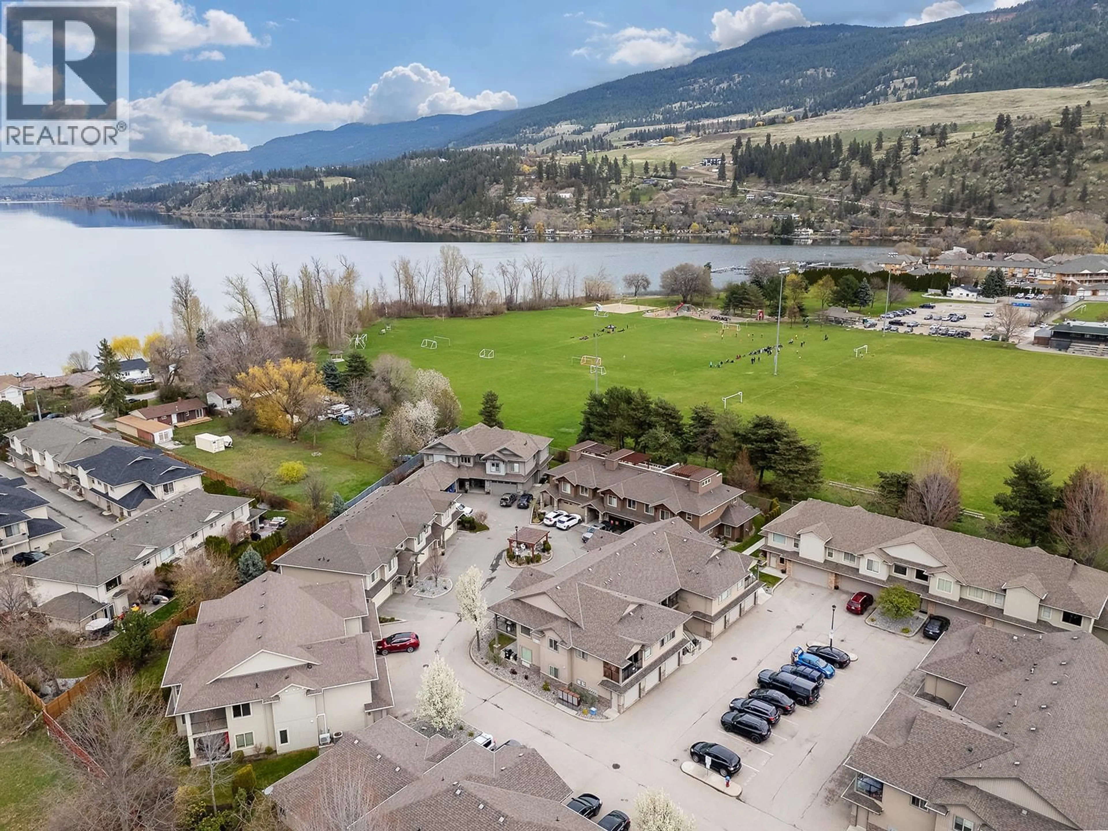 A pic from outside/outdoor area/front of a property/back of a property/a pic from drone, water/lake/river/ocean view for 401 - 3350 WOODSDALE ROAD, Lake Country British Columbia V4V2R7