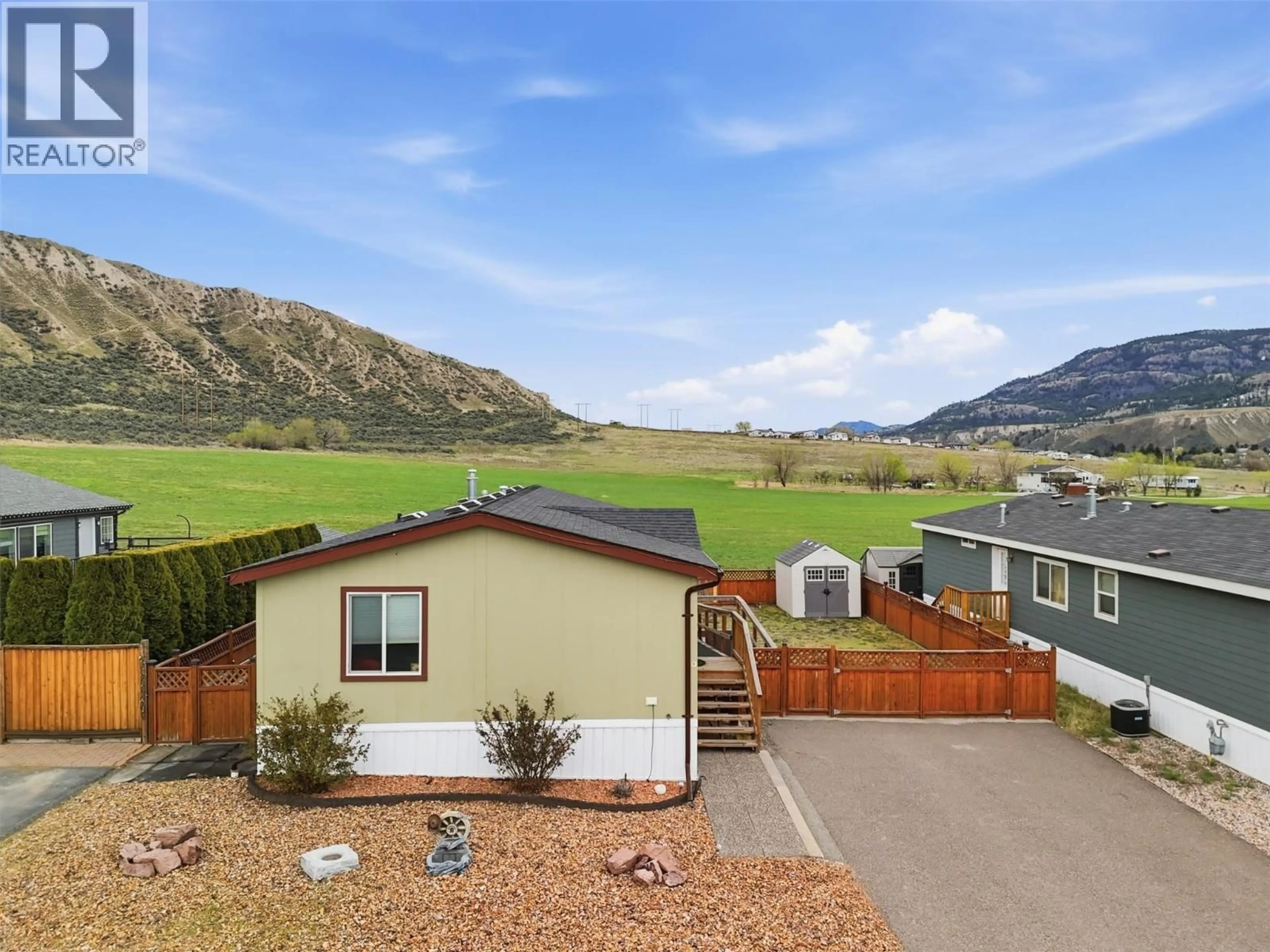 A pic from outside/outdoor area/front of a property/back of a property/a pic from drone, mountain view for 9 - 712 SHUSWAP ROAD EAST, Kamloops British Columbia V2H0C8