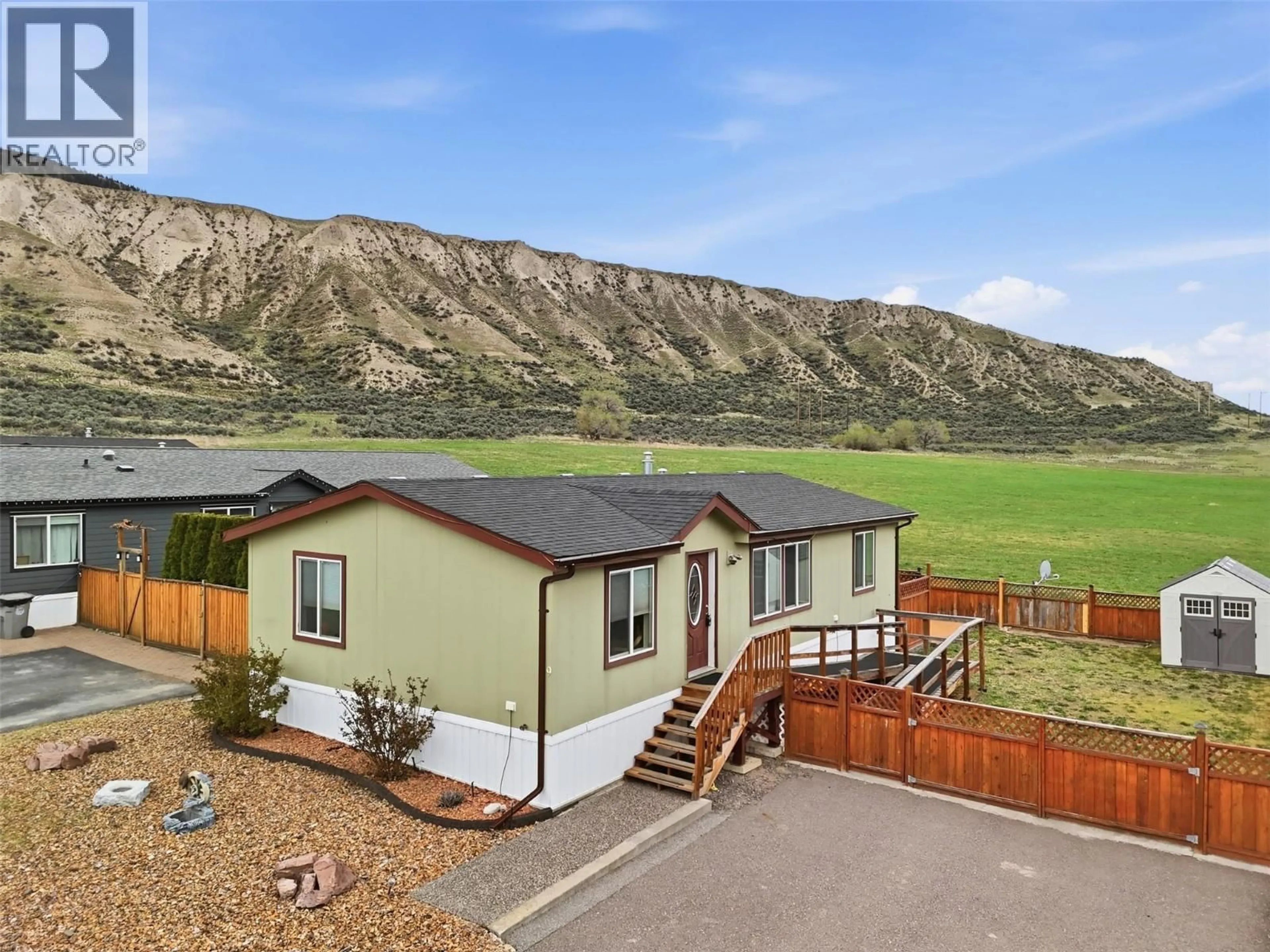 A pic from outside/outdoor area/front of a property/back of a property/a pic from drone, mountain view for 9 - 712 SHUSWAP ROAD EAST, Kamloops British Columbia V2H0C8