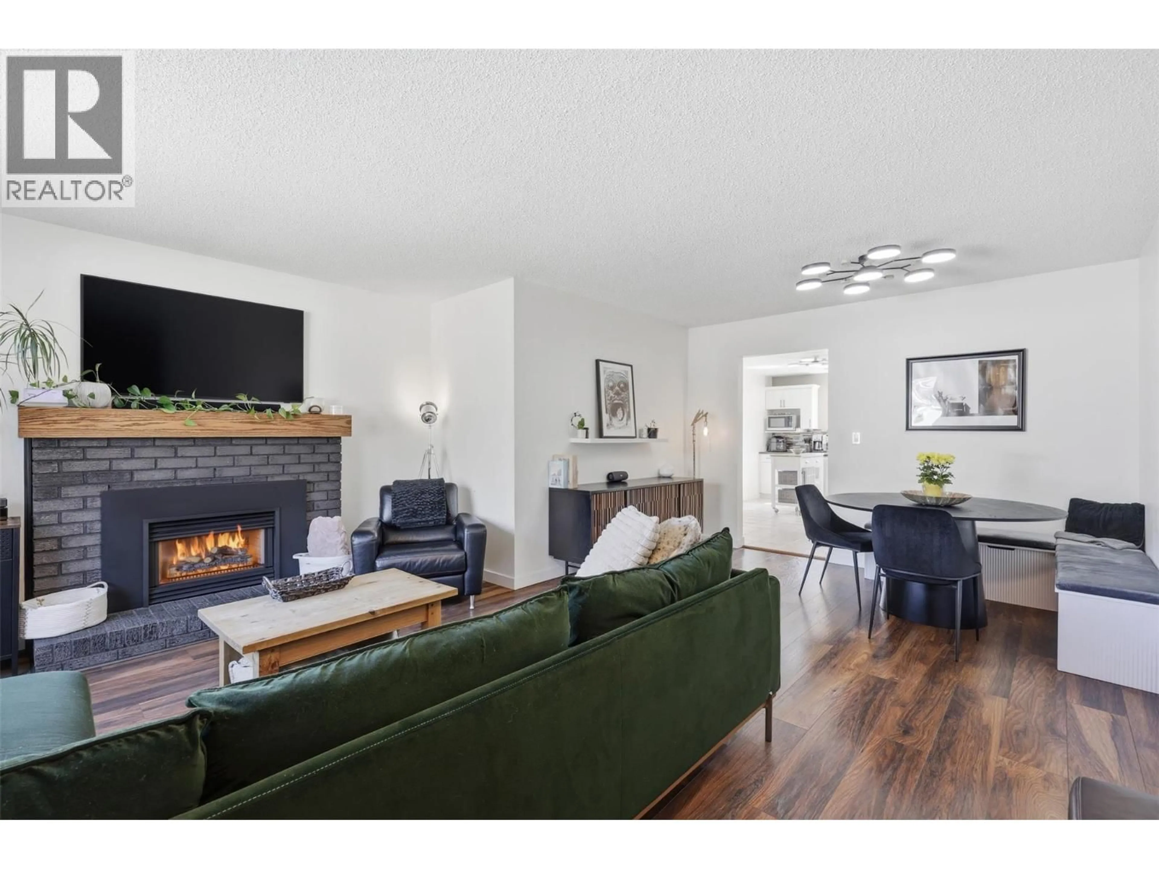 Living room with furniture, wood/laminate floor for 2177 COMMUNITY PLACE, Kamloops British Columbia V2B7Y6