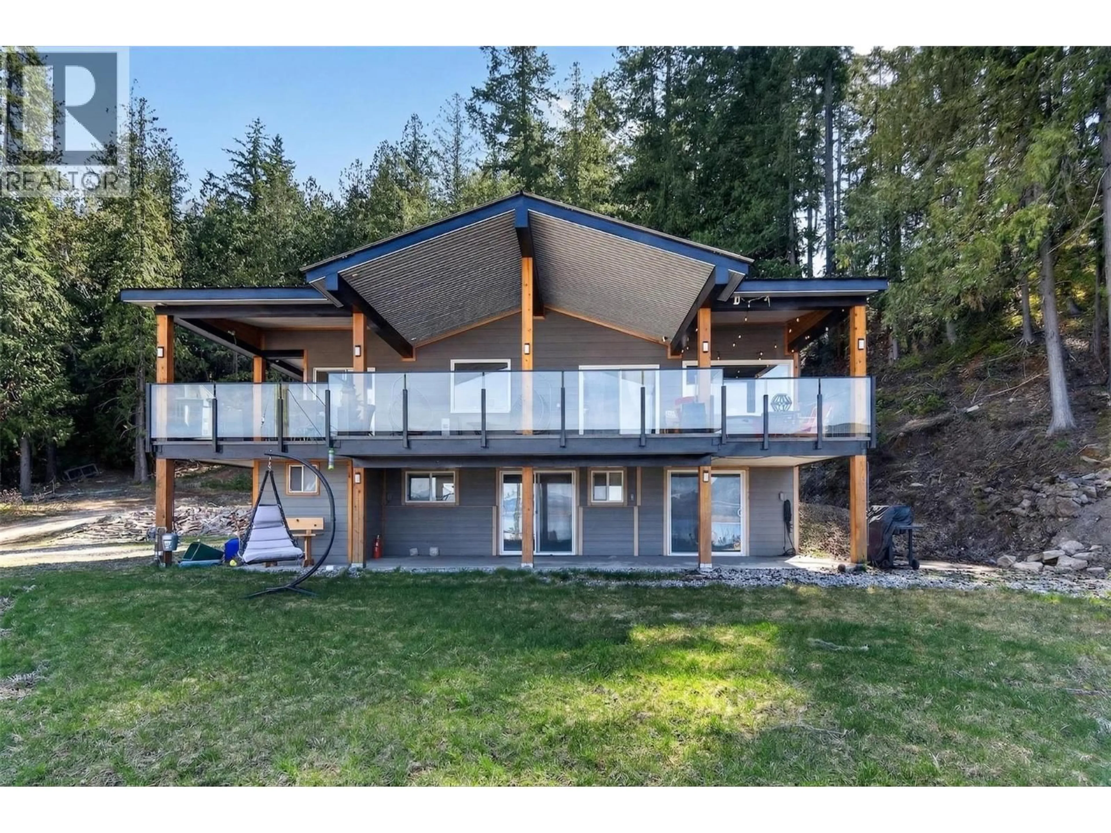 A pic from outside/outdoor area/front of a property/back of a property/a pic from drone, mountain view for 1360 TRANS CANADA HIGHWAY NORTHEAST, Salmon Arm British Columbia V1E2S6