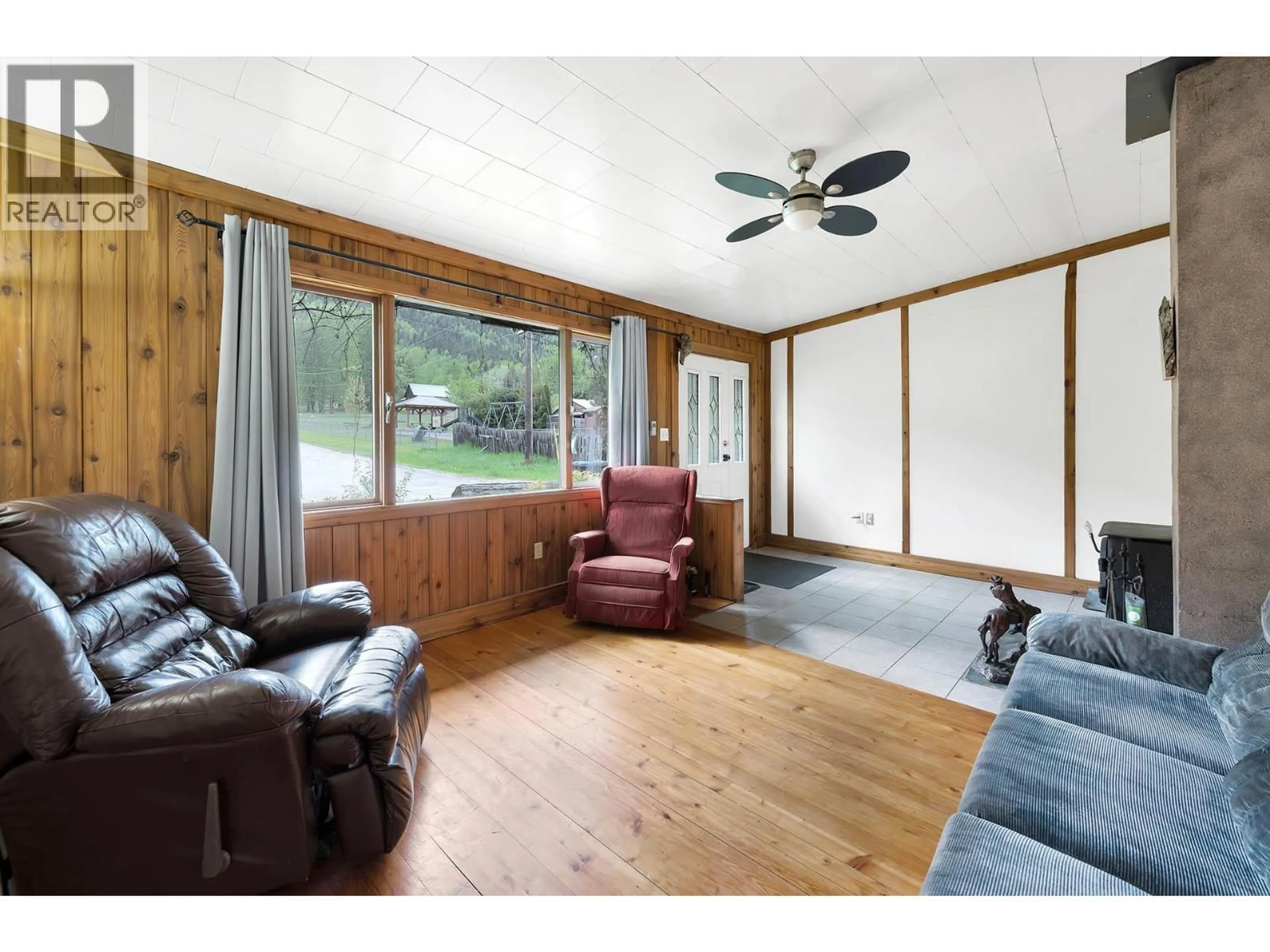 Living room with furniture, wood/laminate floor for 3782 RIVER DRIVE, Blue River British Columbia V0E1C0