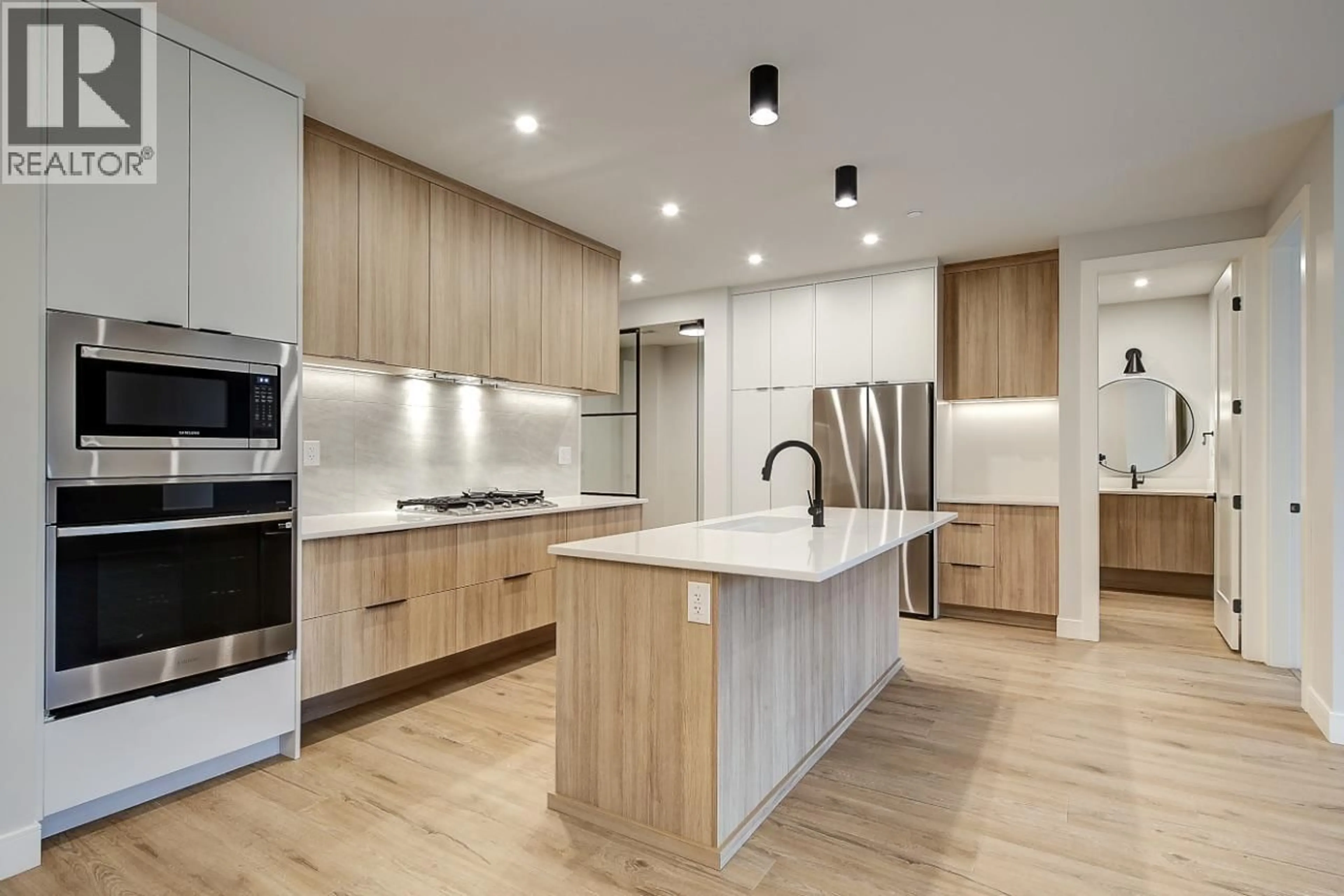 Contemporary kitchen, wood/laminate floor for 205 - 75 PREDATOR RIDGE DRIVE, Vernon British Columbia V1H2H1