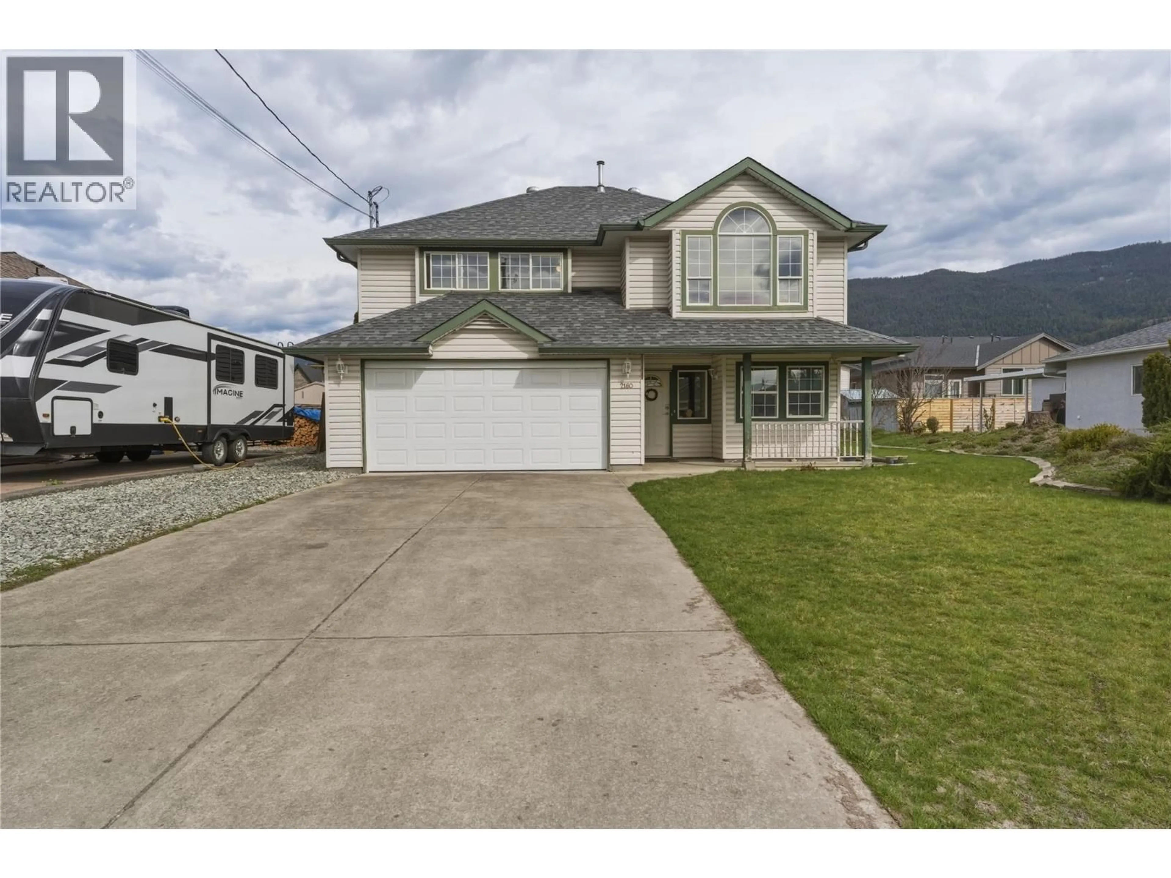 Home with vinyl exterior material, street for 2160 OKANAGAN STREET, Armstrong British Columbia V4Y0C4