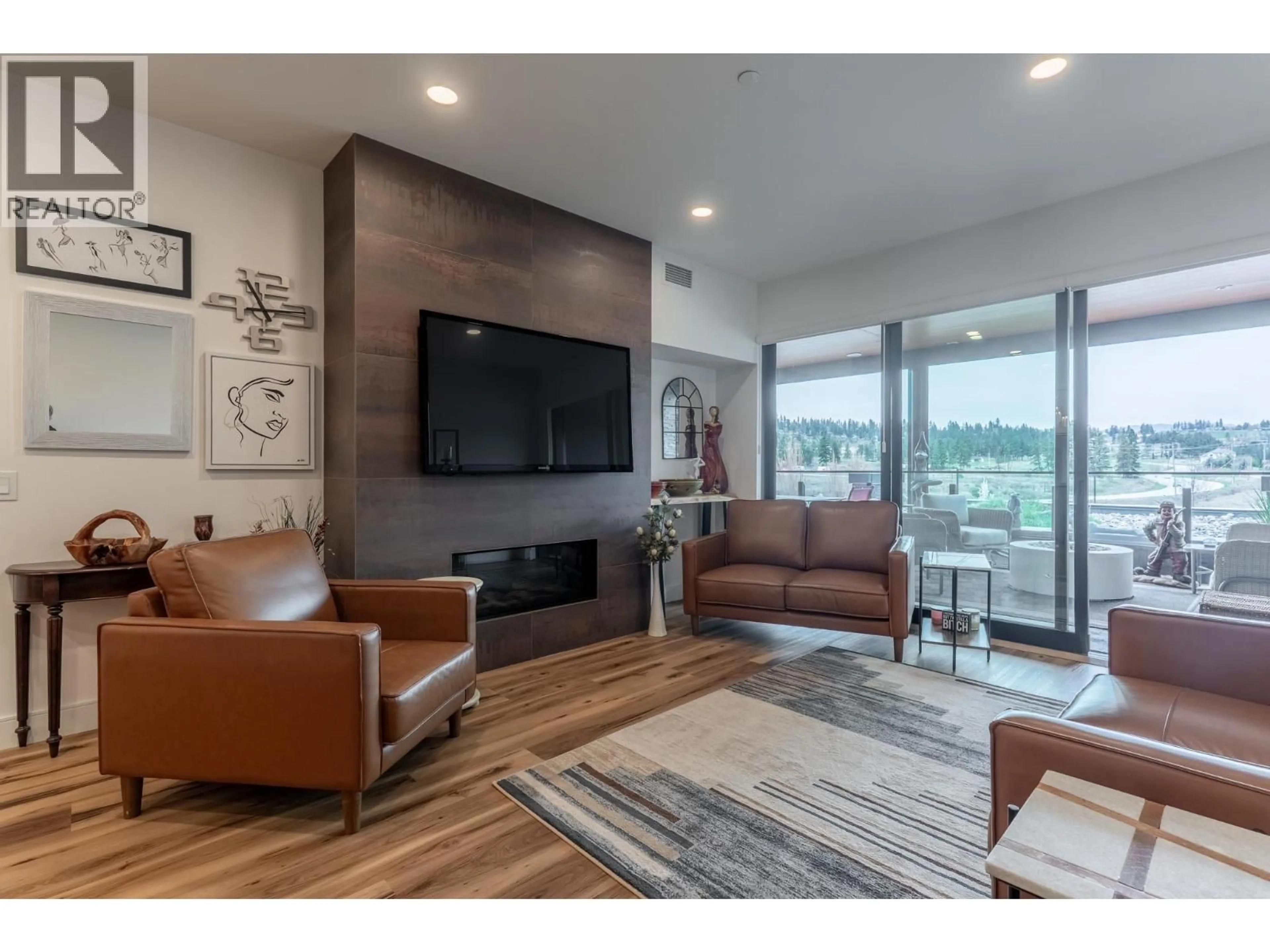 Living room with furniture, wood/laminate floor for 3207 - 3000 ARIVA DRIVE, West Kelowna British Columbia V1Z0B3
