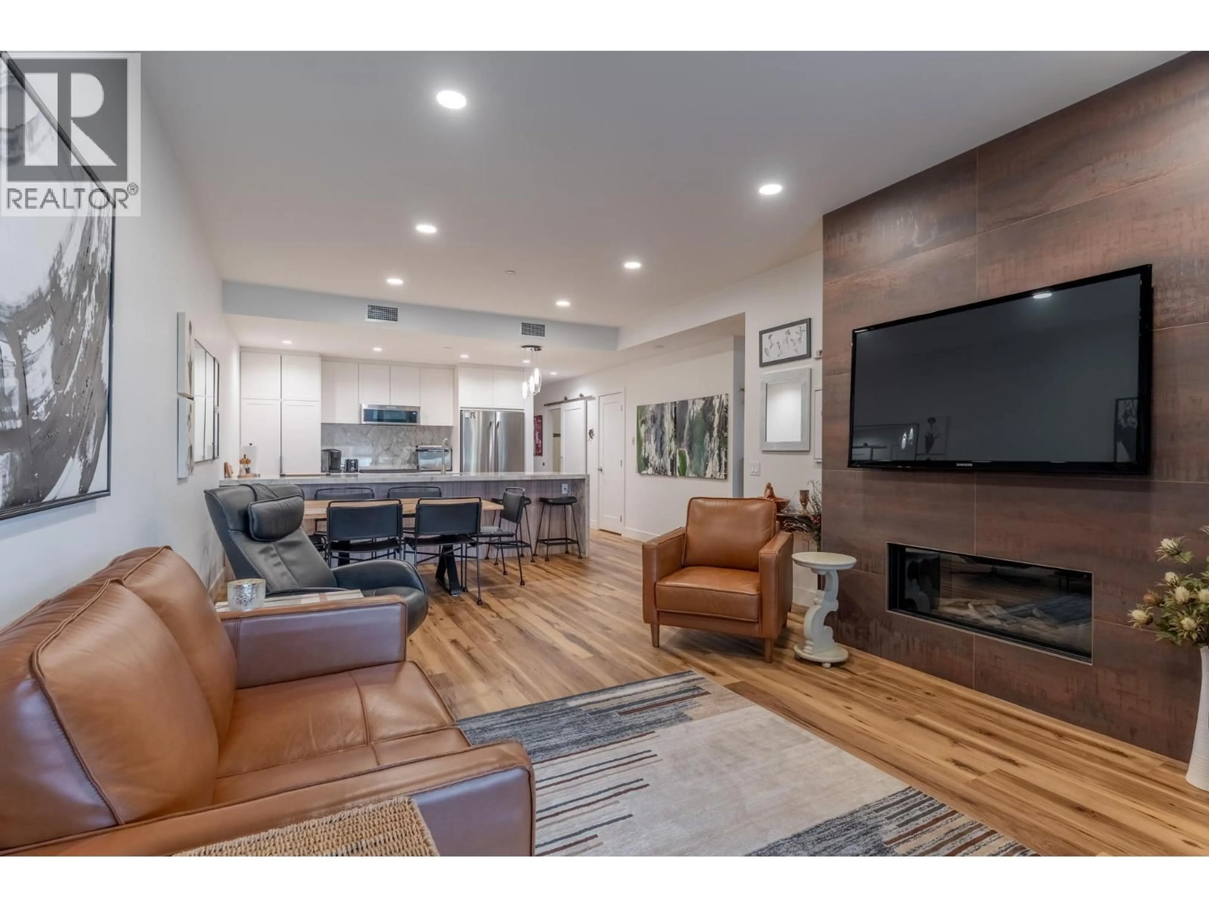 Living room with furniture, wood/laminate floor for 3207 - 3000 ARIVA DRIVE, West Kelowna British Columbia V1Z0B3