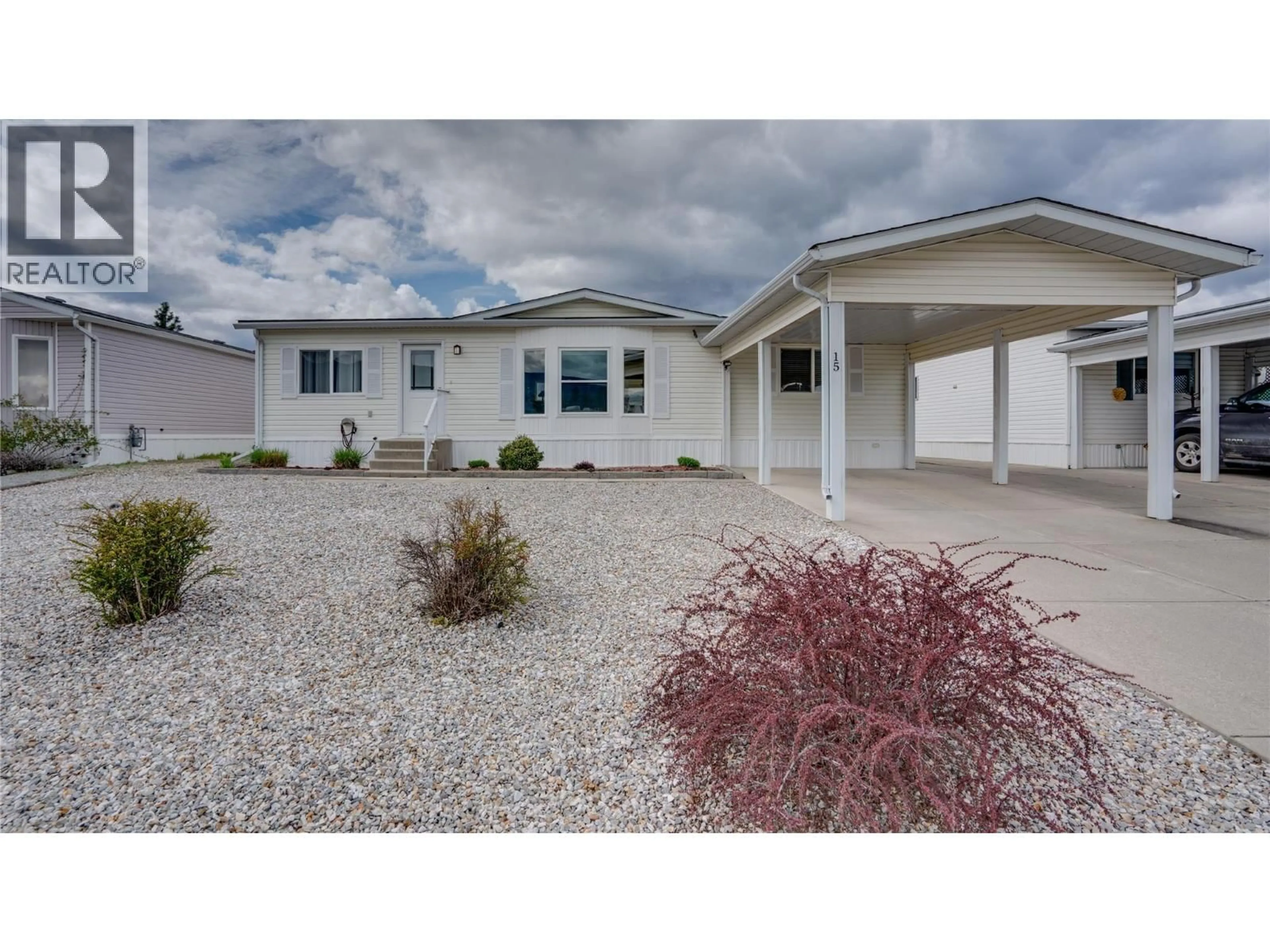 Home with vinyl exterior material, street for 15 - 9510 HIGHWAY 97N HIGHWAY, Vernon British Columbia V1H1R8