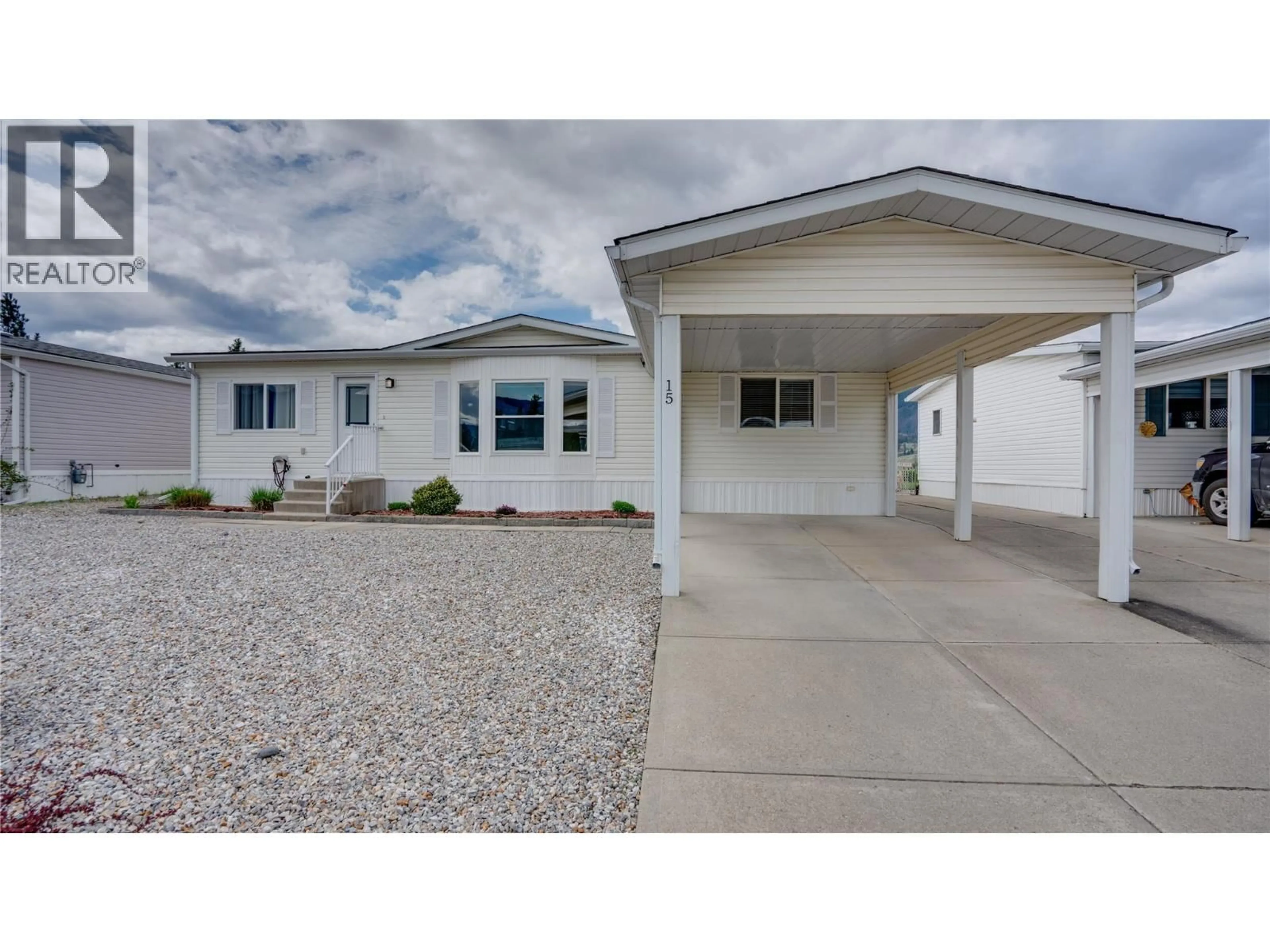 Home with vinyl exterior material, street for 15 - 9510 HIGHWAY 97N HIGHWAY, Vernon British Columbia V1H1R8