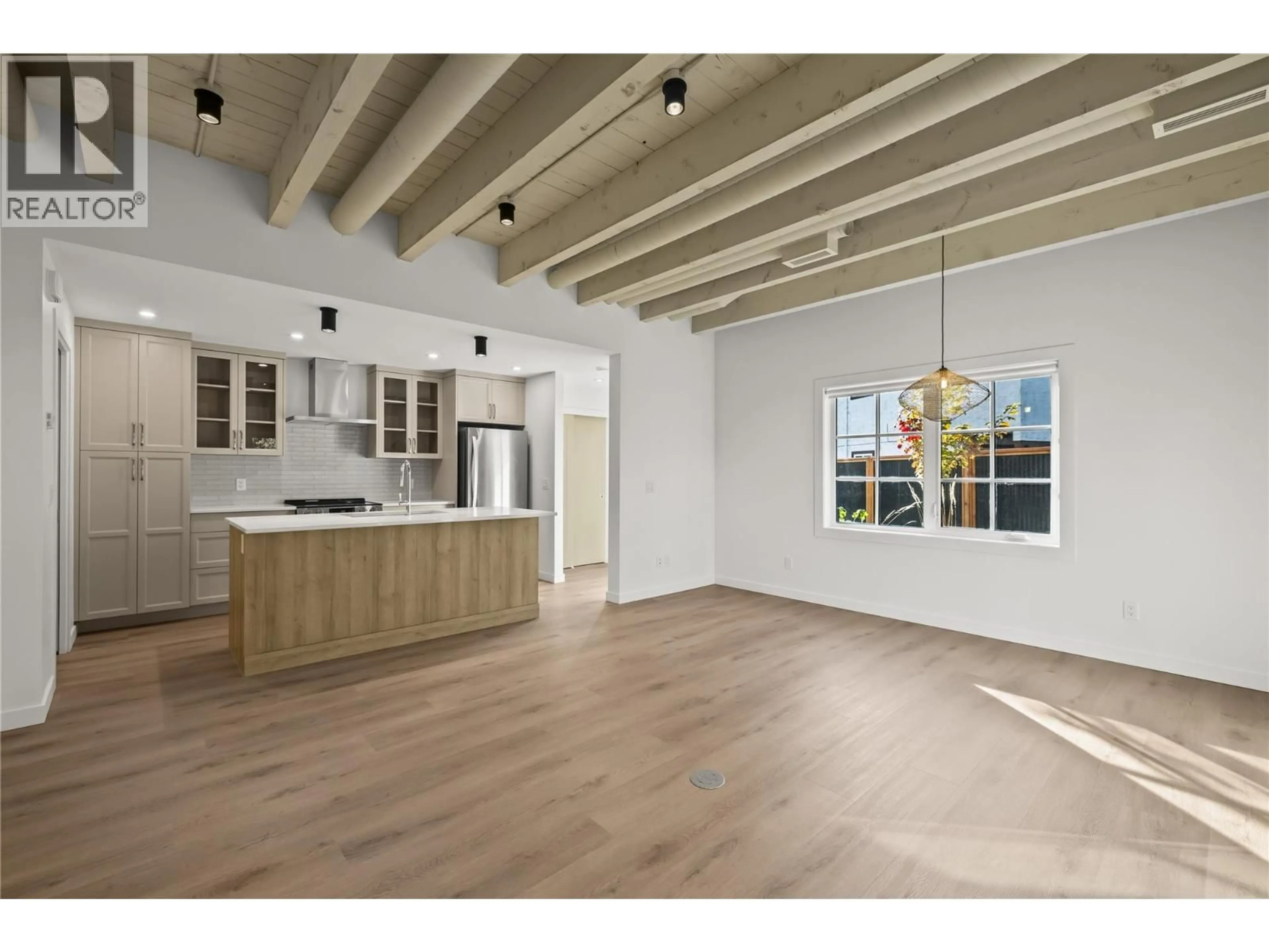 Open concept kitchen, wood/laminate floor for 1 - 2957 CONLIN COURT, Kelowna British Columbia V1Y7S7