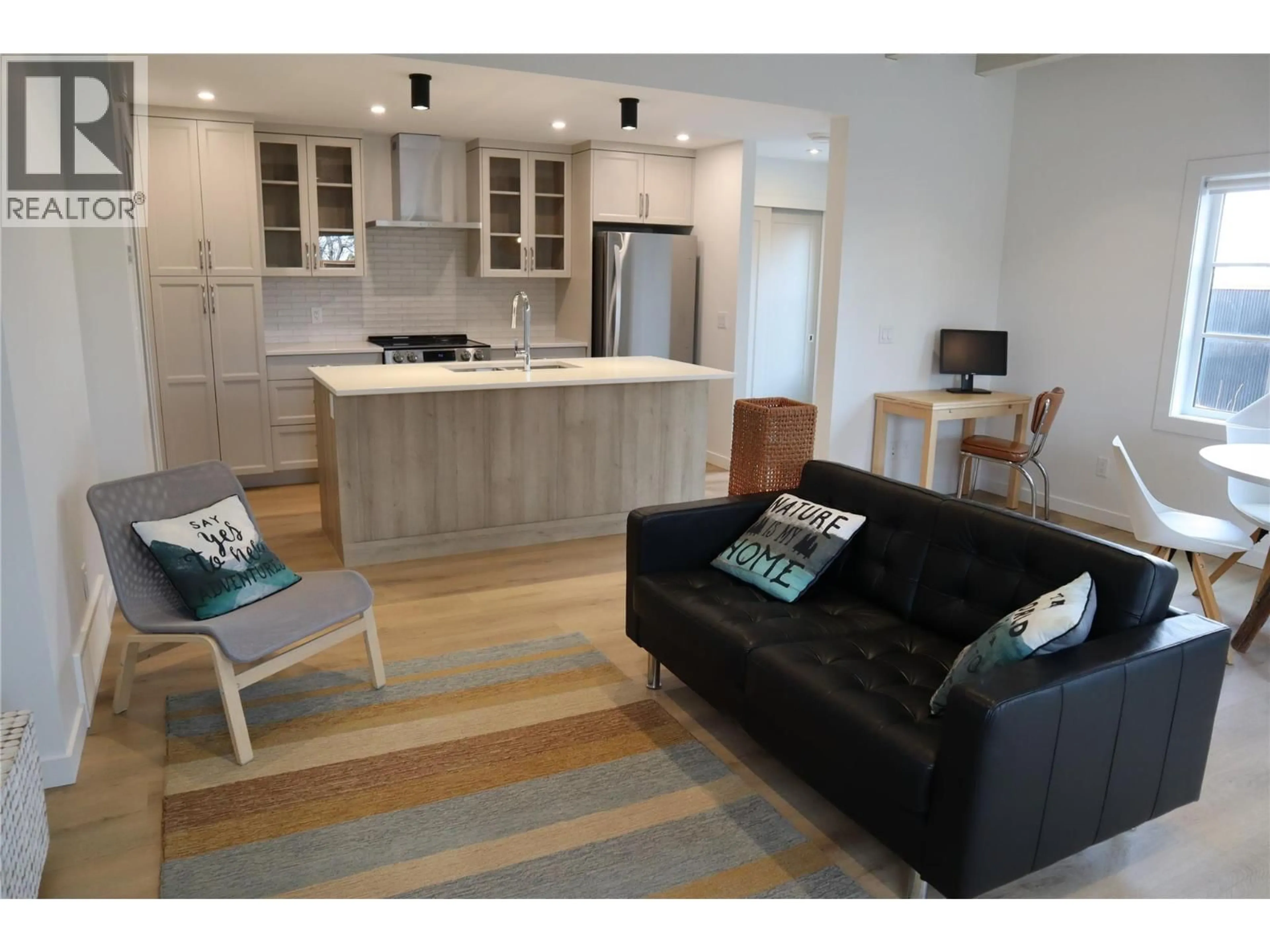 Open concept kitchen, wood/laminate floor for 1 - 2957 CONLIN COURT, Kelowna British Columbia V1Y7S7