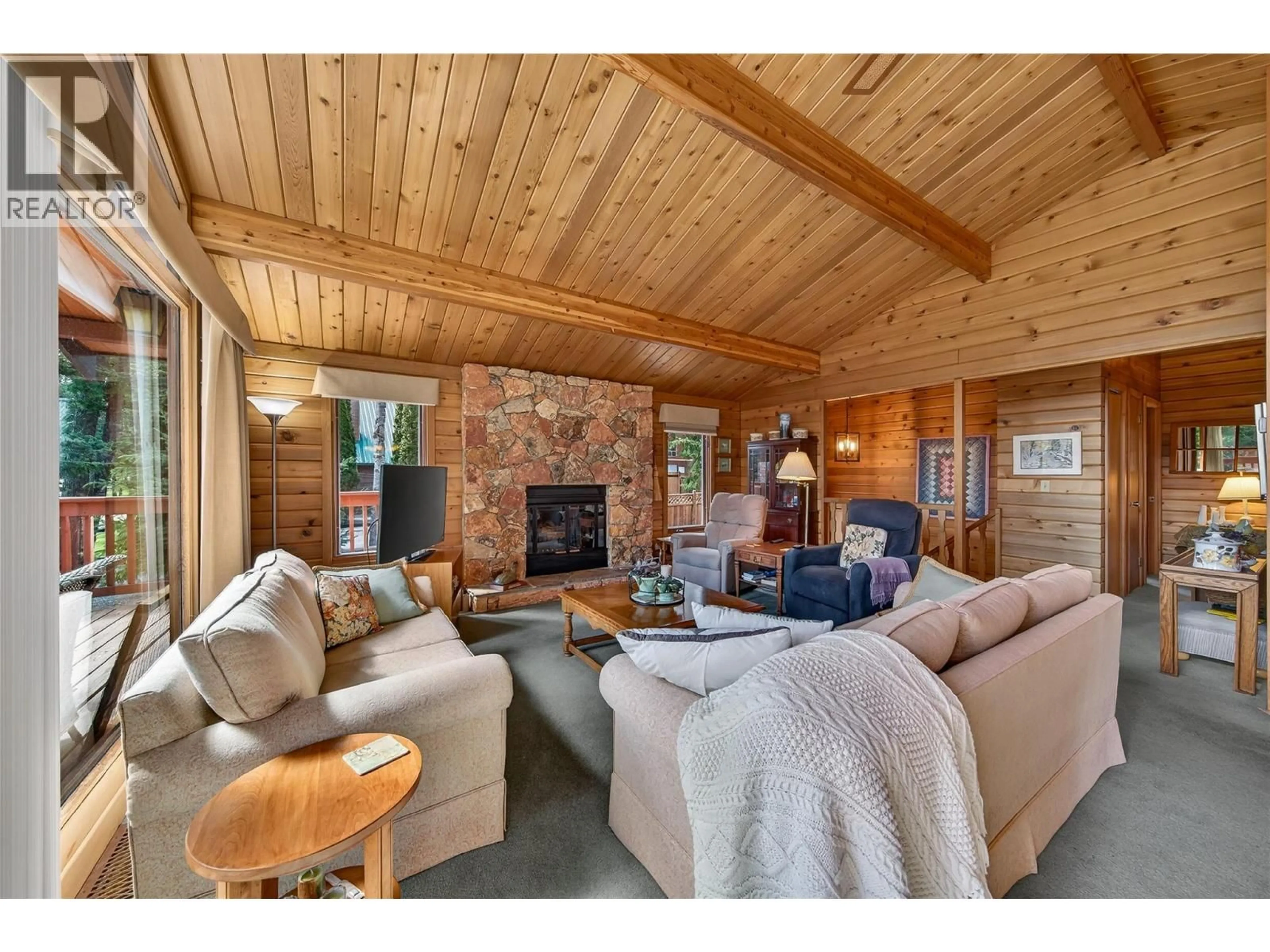 Living room with furniture, wood/laminate floor for 4613 COLUMERE ROAD, Fairmont Hot Springs British Columbia V0B1L1