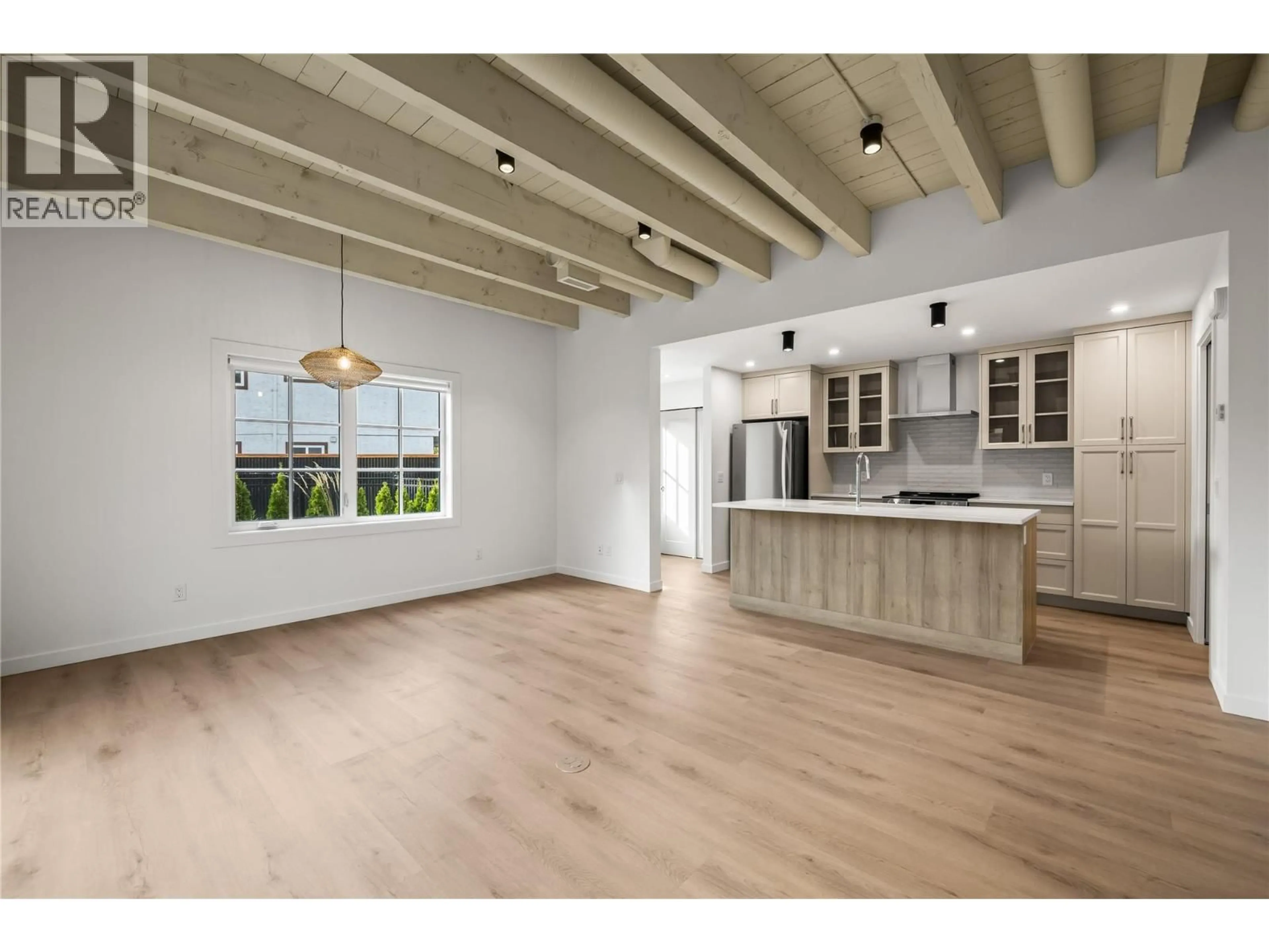 Open concept kitchen, wood/laminate floor for 2 - 2957 CONLIN COURT, Kelowna British Columbia V1Y7S7
