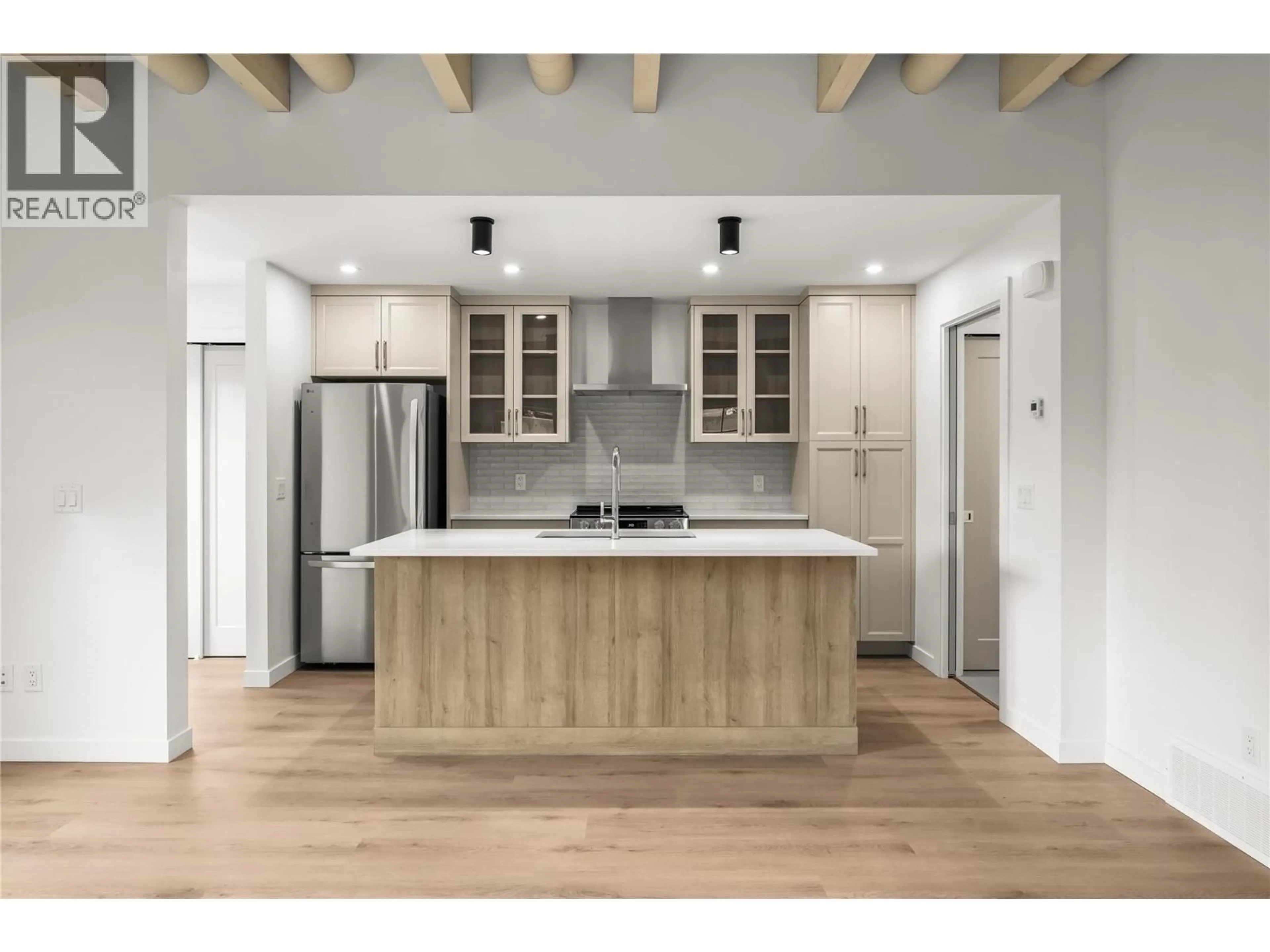 Open concept kitchen, wood/laminate floor for 2 - 2957 CONLIN COURT, Kelowna British Columbia V1Y7S7