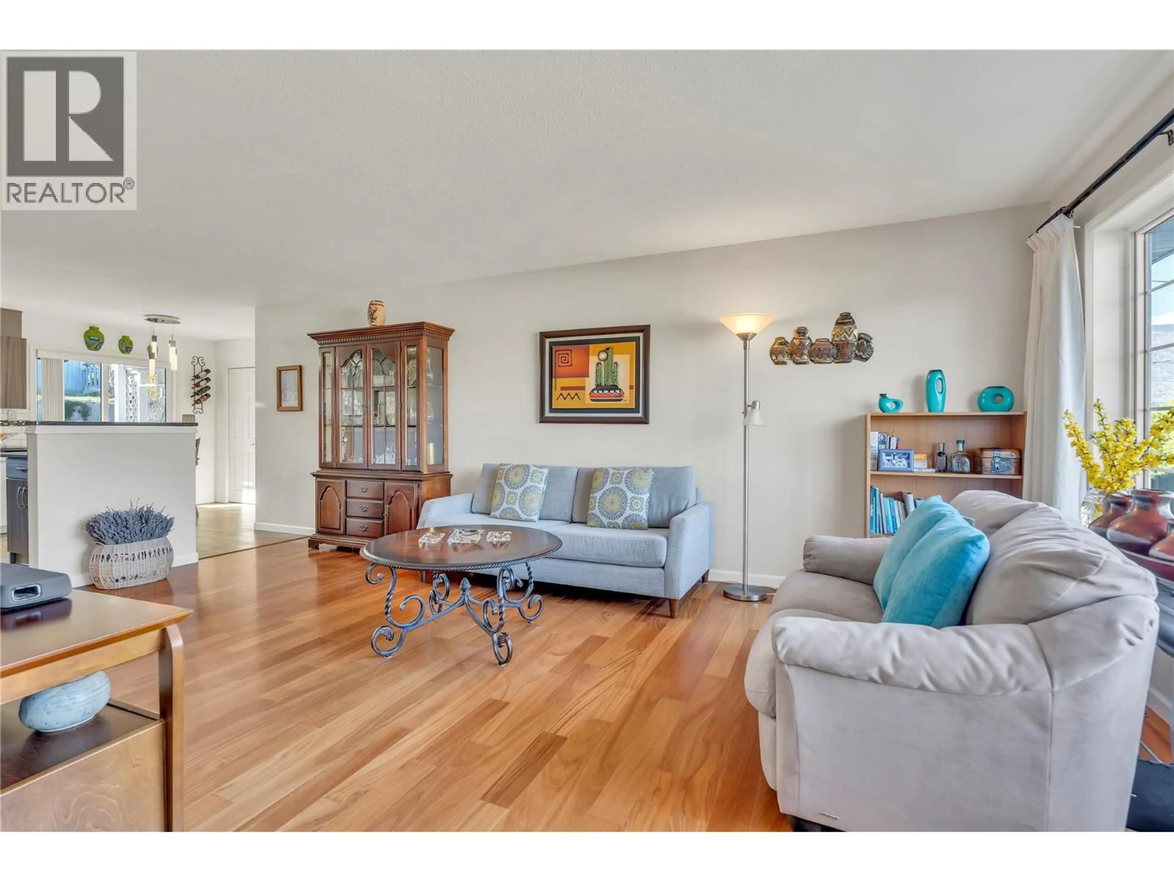 Living room with furniture, wood/laminate floor for 5878 TULAMEEN STREET, Oliver British Columbia V0H1T0