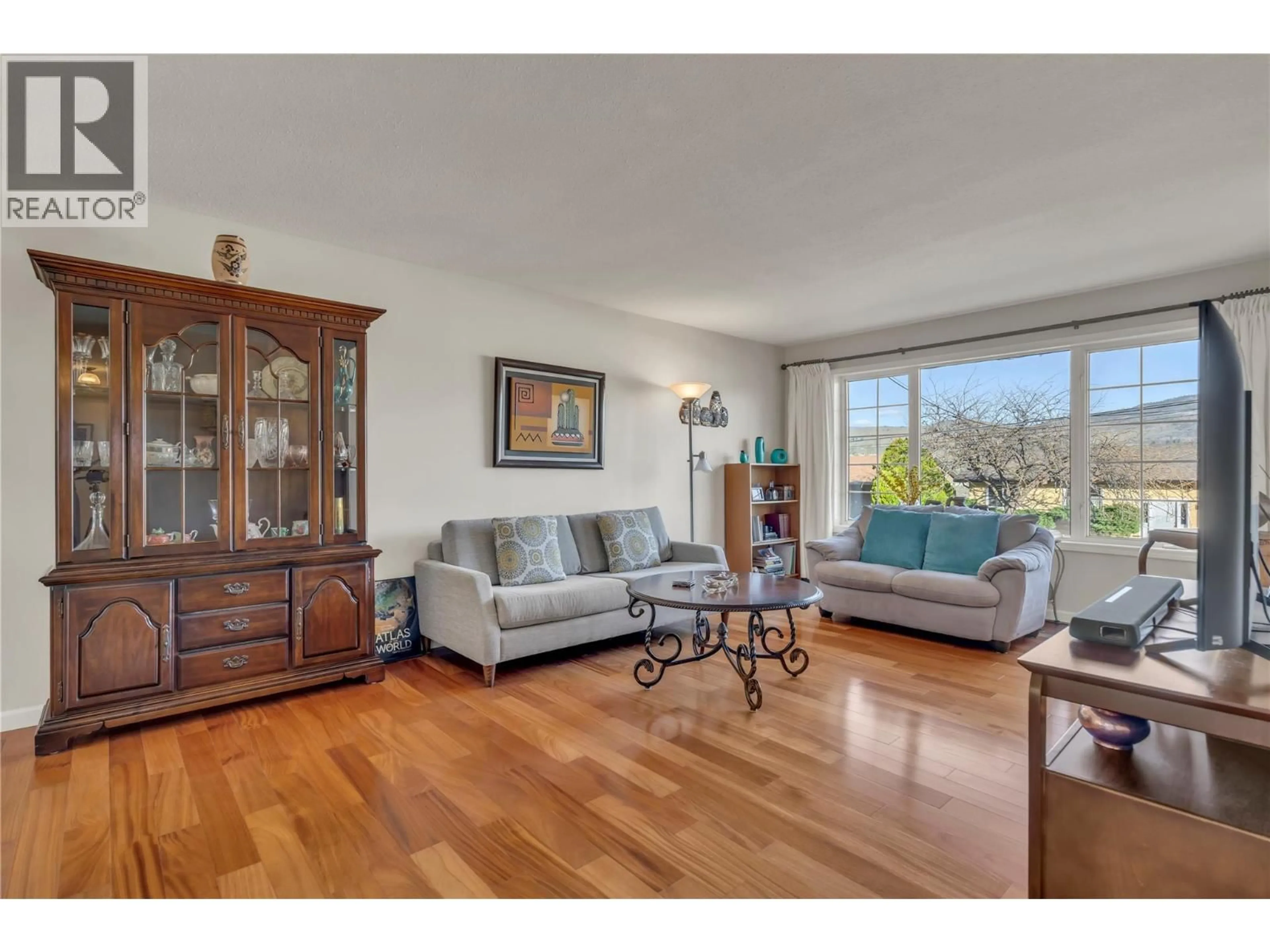 Living room with furniture, wood/laminate floor for 5878 TULAMEEN STREET, Oliver British Columbia V0H1T0