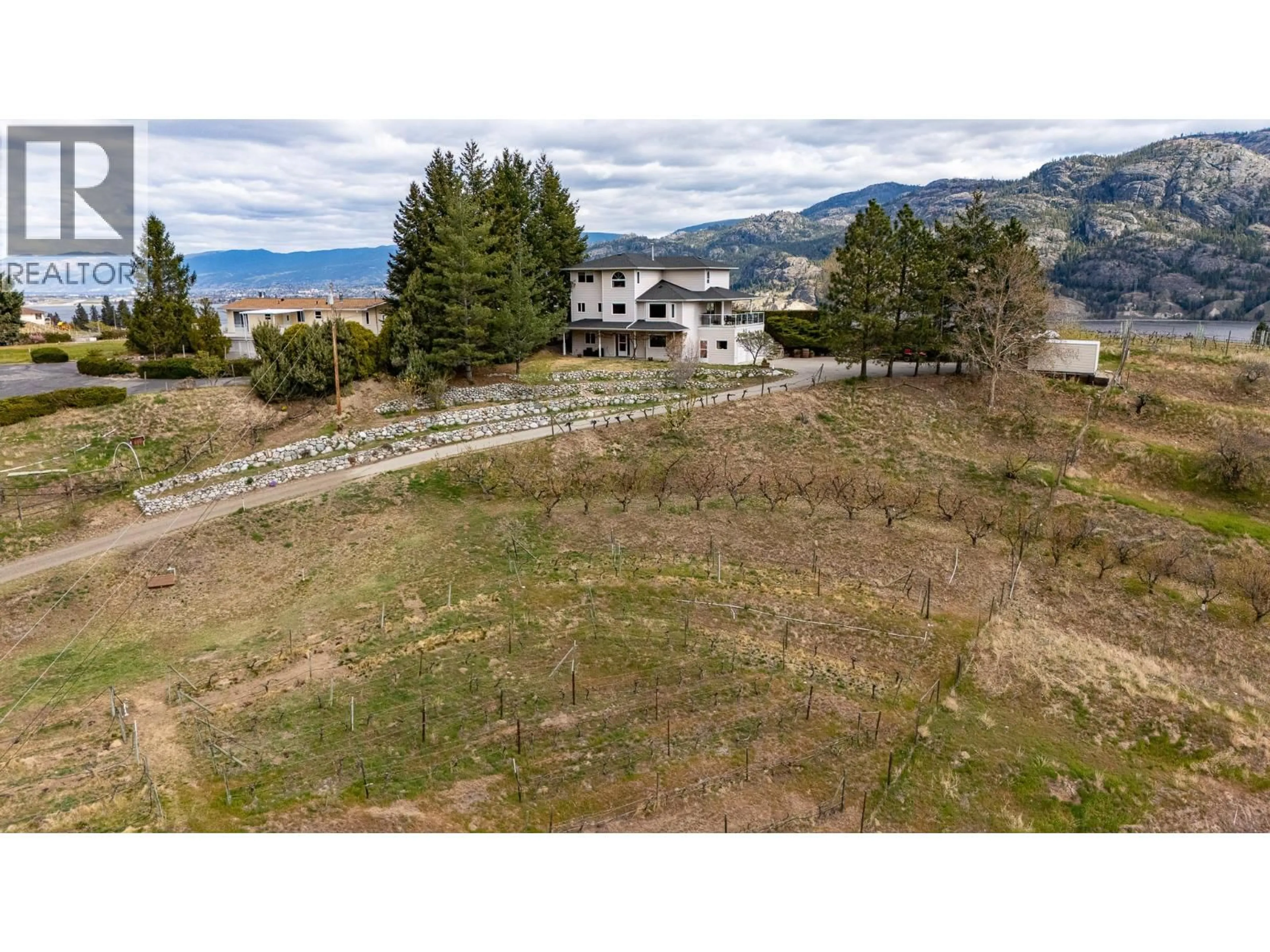 A pic from outside/outdoor area/front of a property/back of a property/a pic from drone, mountain view for 100 SPRUCE AVENUE, Kaleden British Columbia V0H1K0