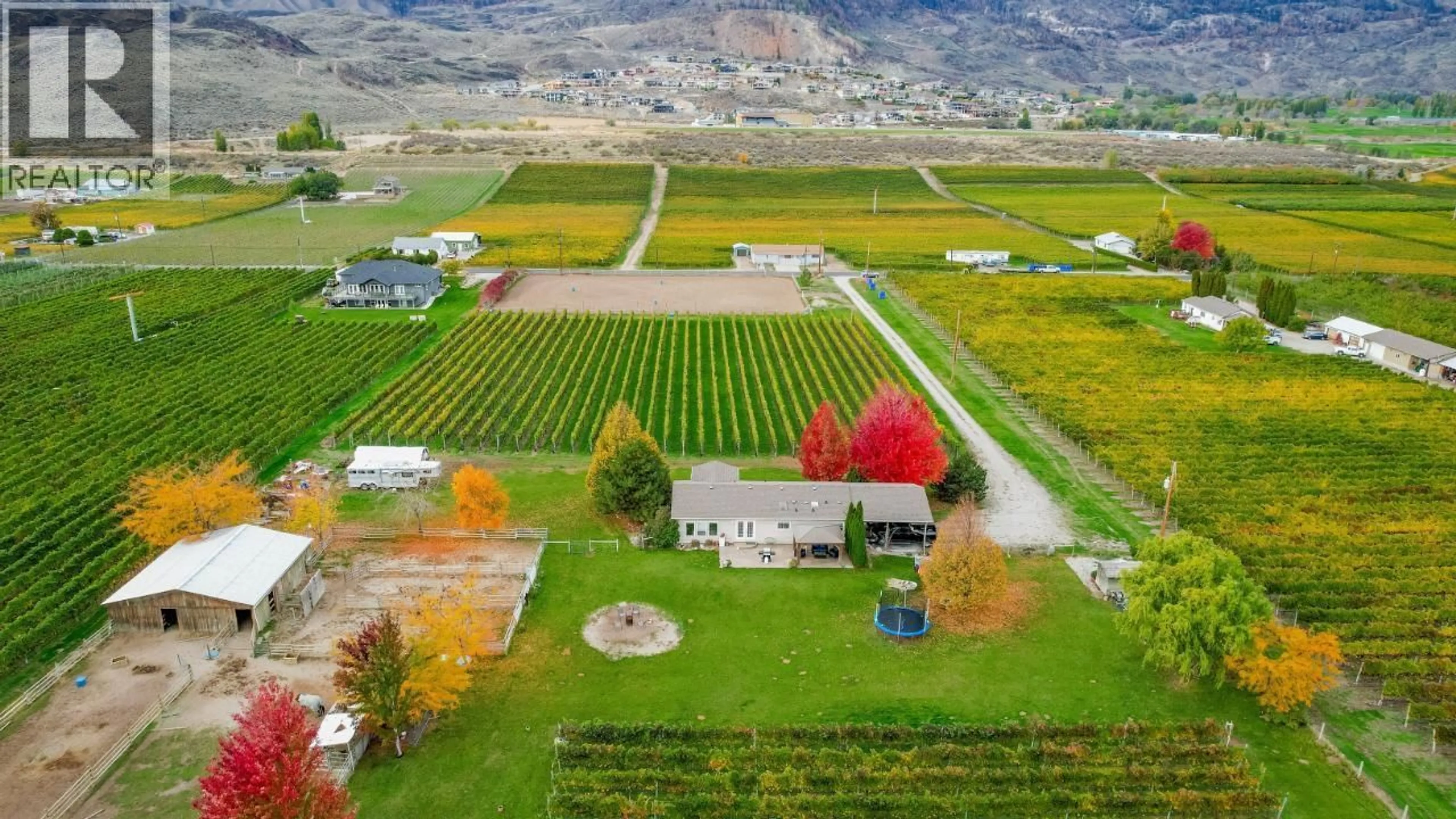 A pic from outside/outdoor area/front of a property/back of a property/a pic from drone, mountain view for 3405 107TH STREET, Osoyoos British Columbia V0H1V4