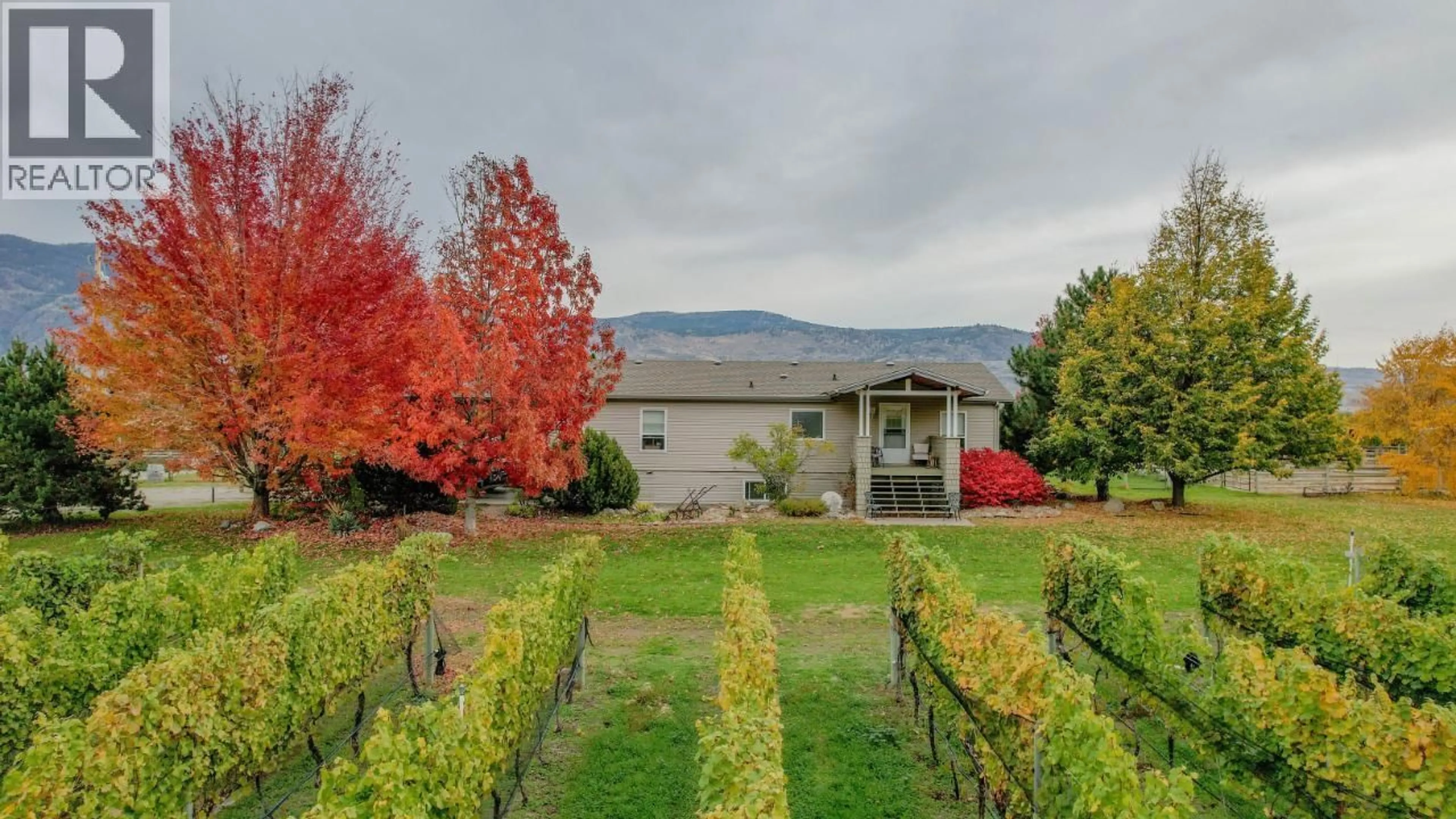 A pic from outside/outdoor area/front of a property/back of a property/a pic from drone, mountain view for 3405 107TH STREET, Osoyoos British Columbia V0H1V4