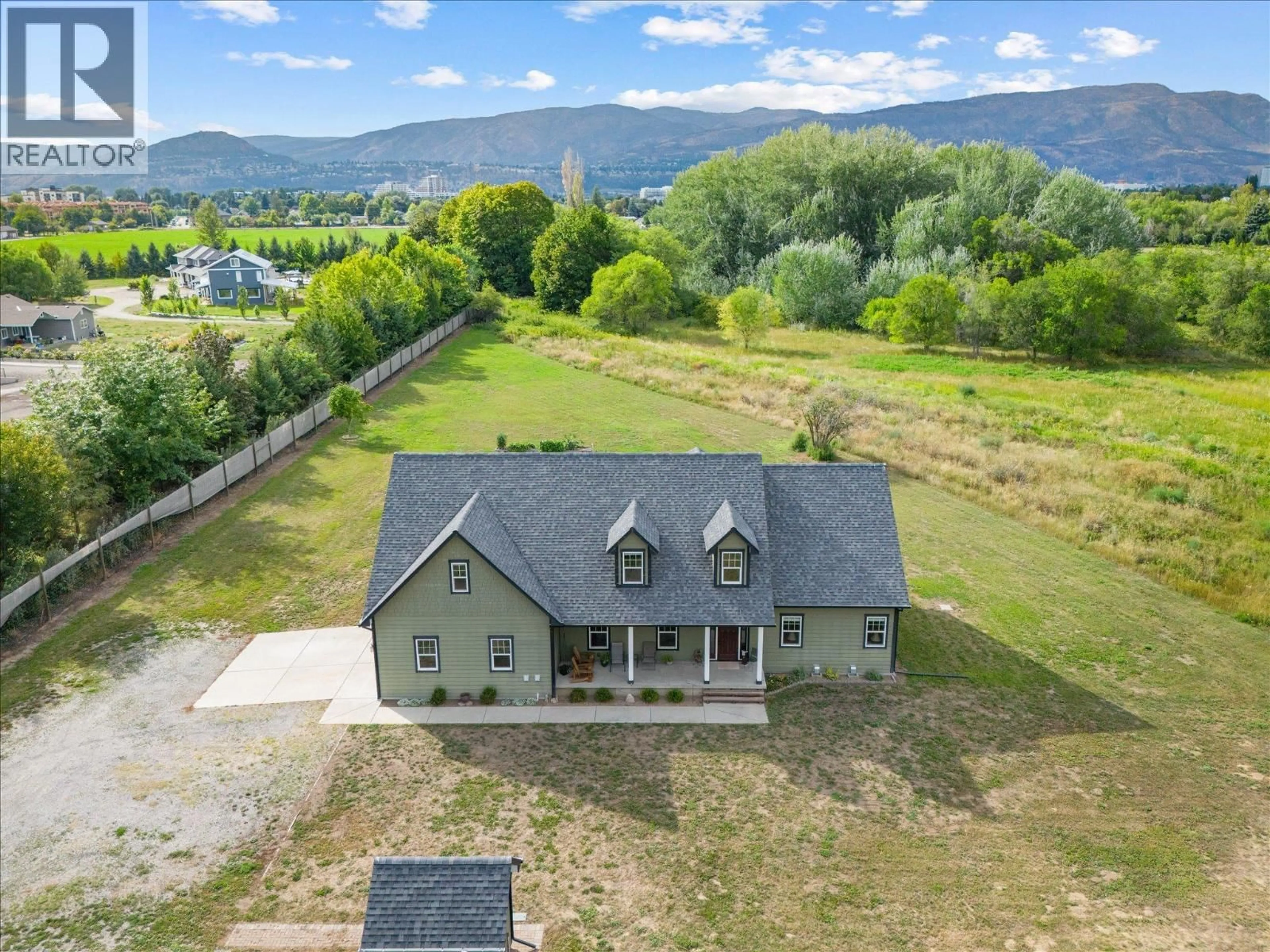 A pic from outside/outdoor area/front of a property/back of a property/a pic from drone, water/lake/river/ocean view for 3550 BENVOULIN ROAD, Kelowna British Columbia V1W4M6