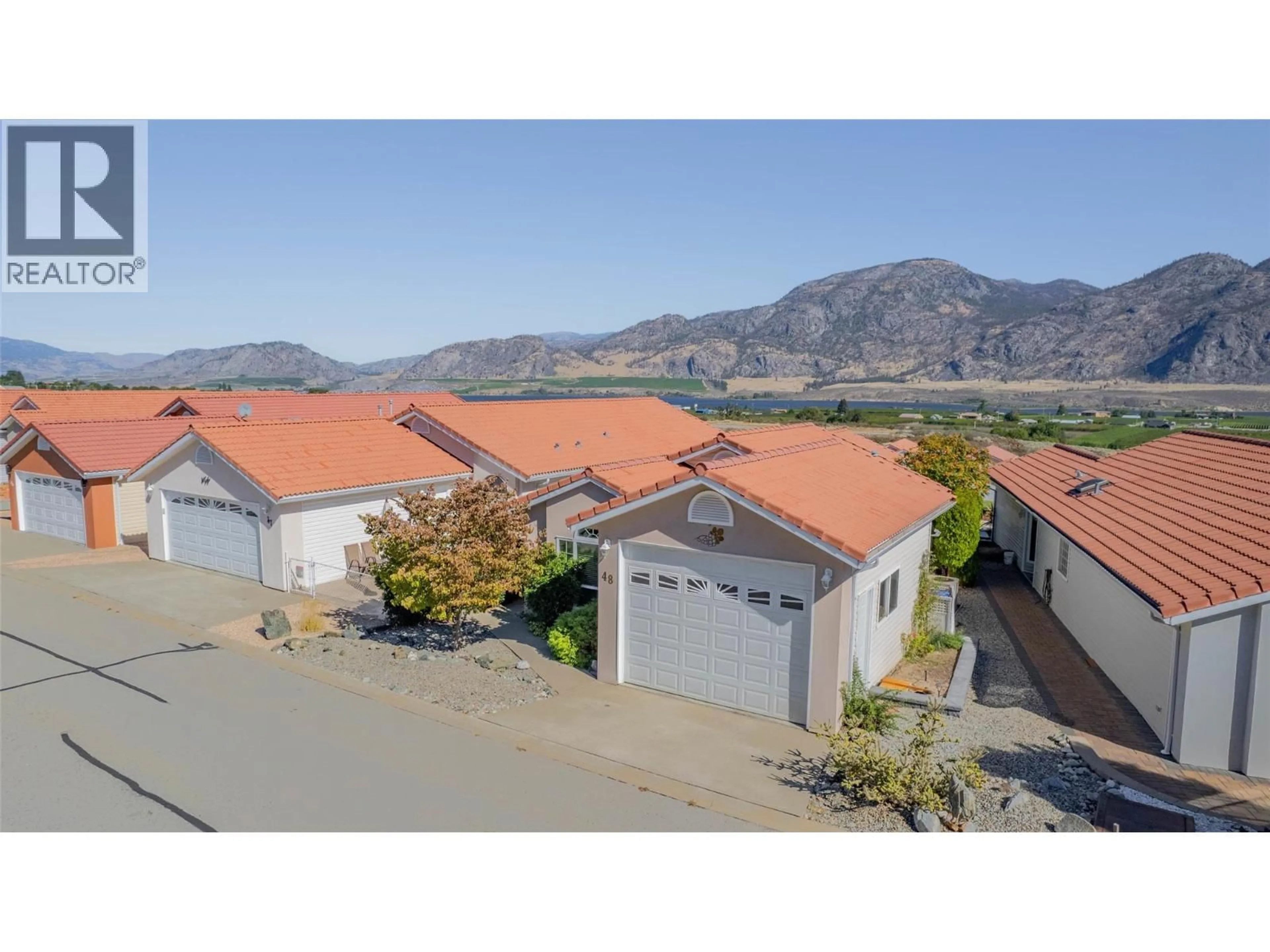 A pic from outside/outdoor area/front of a property/back of a property/a pic from drone, mountain view for 48 - 9400 115 STREET, Osoyoos British Columbia V0H1V5