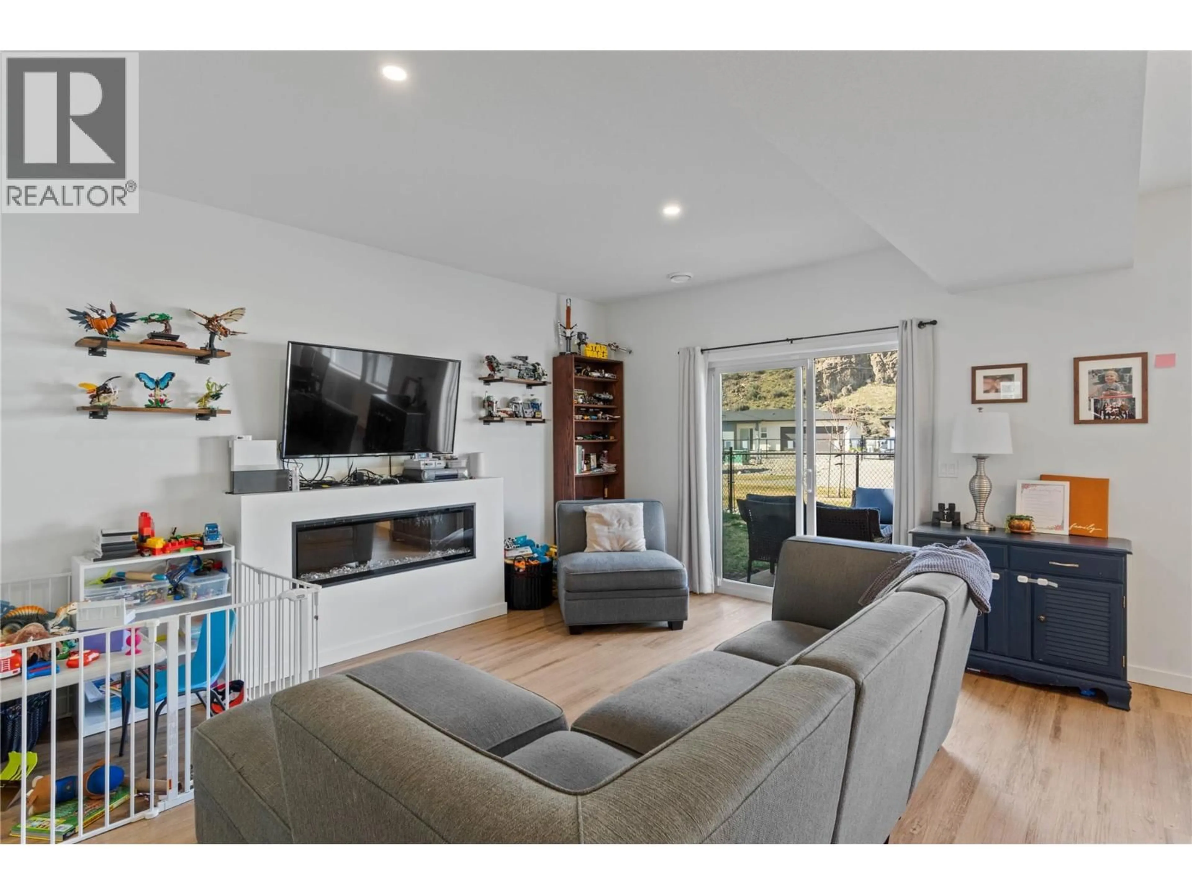 Living room with furniture, wood/laminate floor for 168 - 2683 ORD ROAD, Kamloops British Columbia V2B0J2