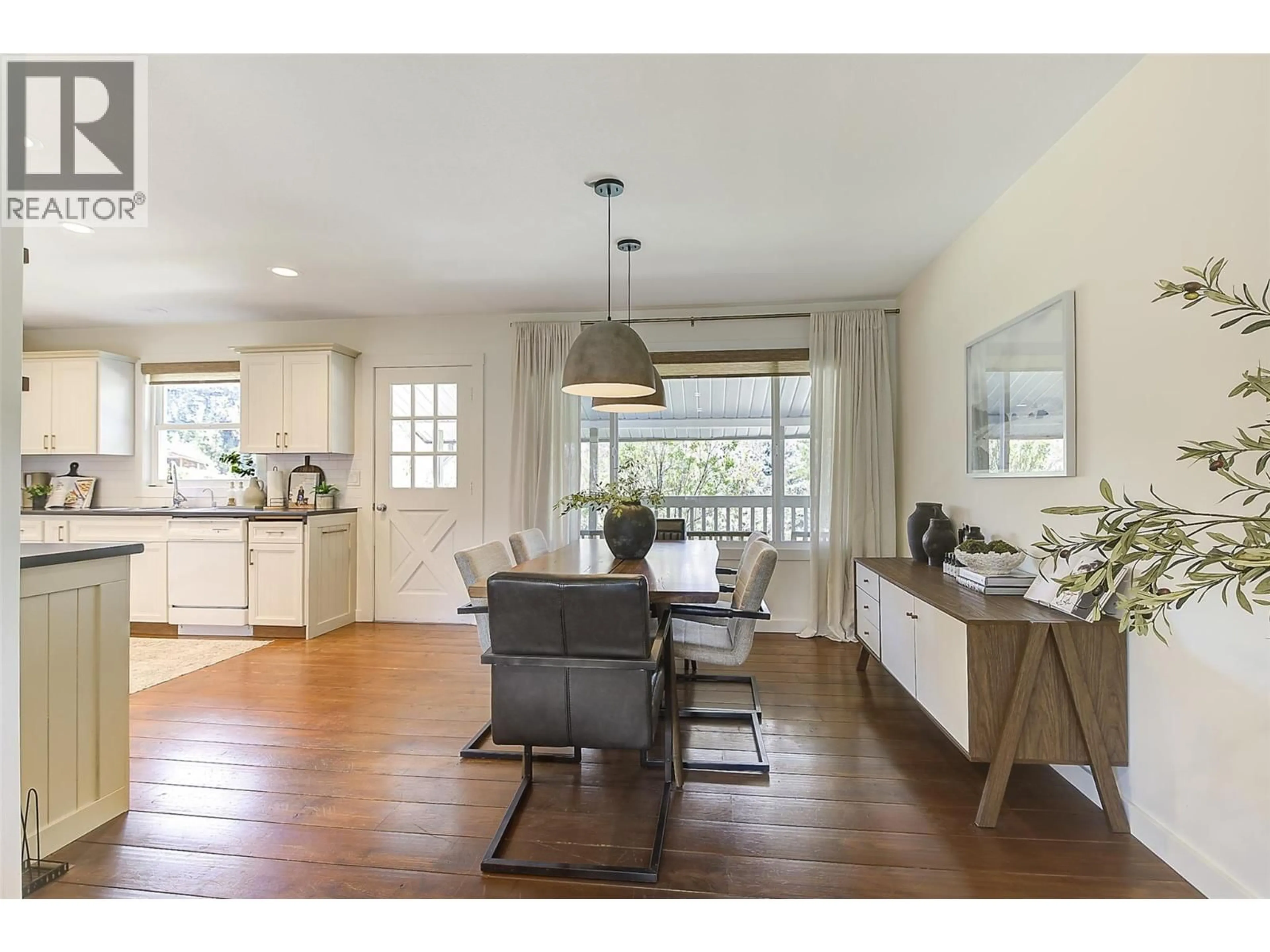 Open concept kitchen, wood/laminate floor for 1520 OAKRIDGE ROAD, Kelowna British Columbia V1W3A9