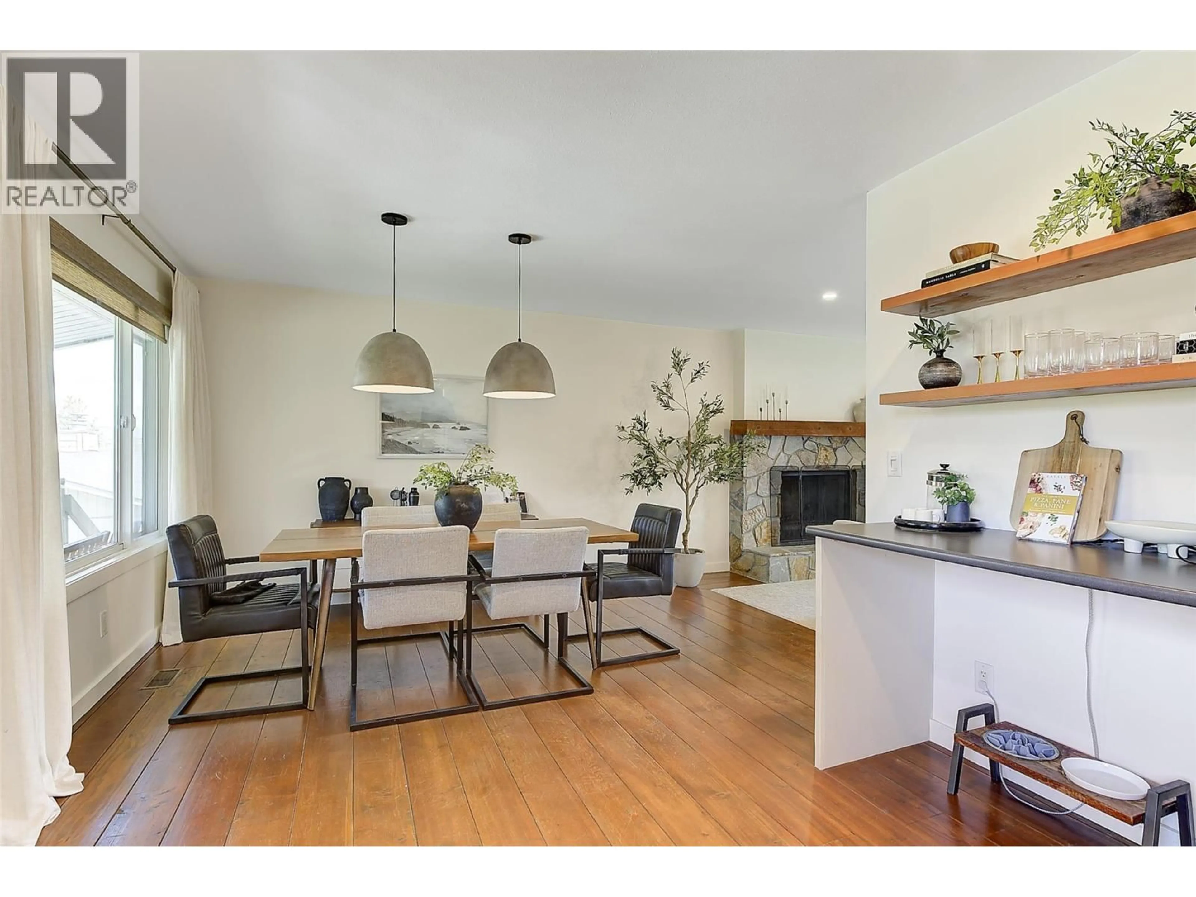 Open concept kitchen, wood/laminate floor for 1520 OAKRIDGE ROAD, Kelowna British Columbia V1W3A9