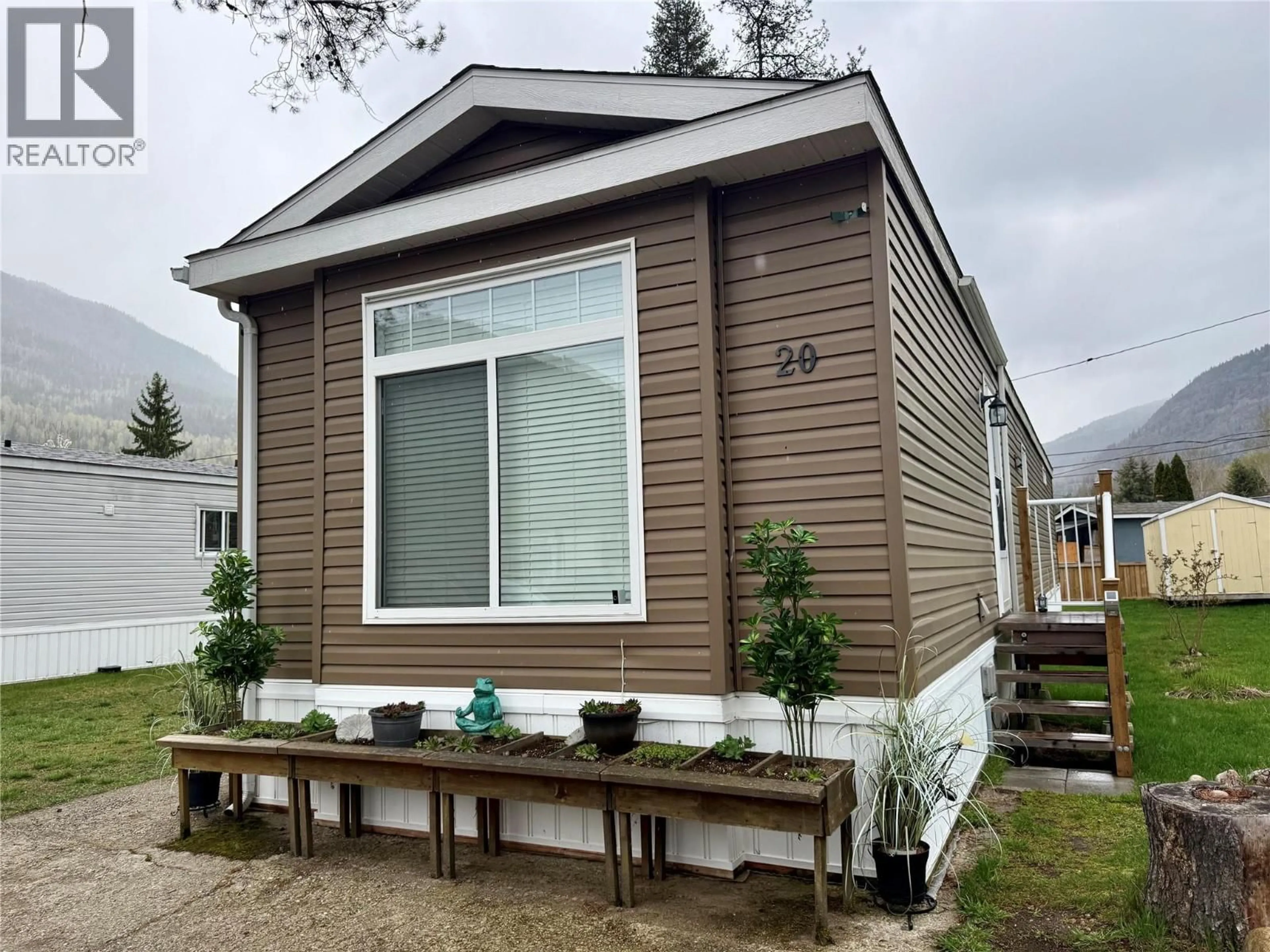 Home with vinyl exterior material, street for 20 - 500 16TH AVENUE, Genelle British Columbia V0G1G0