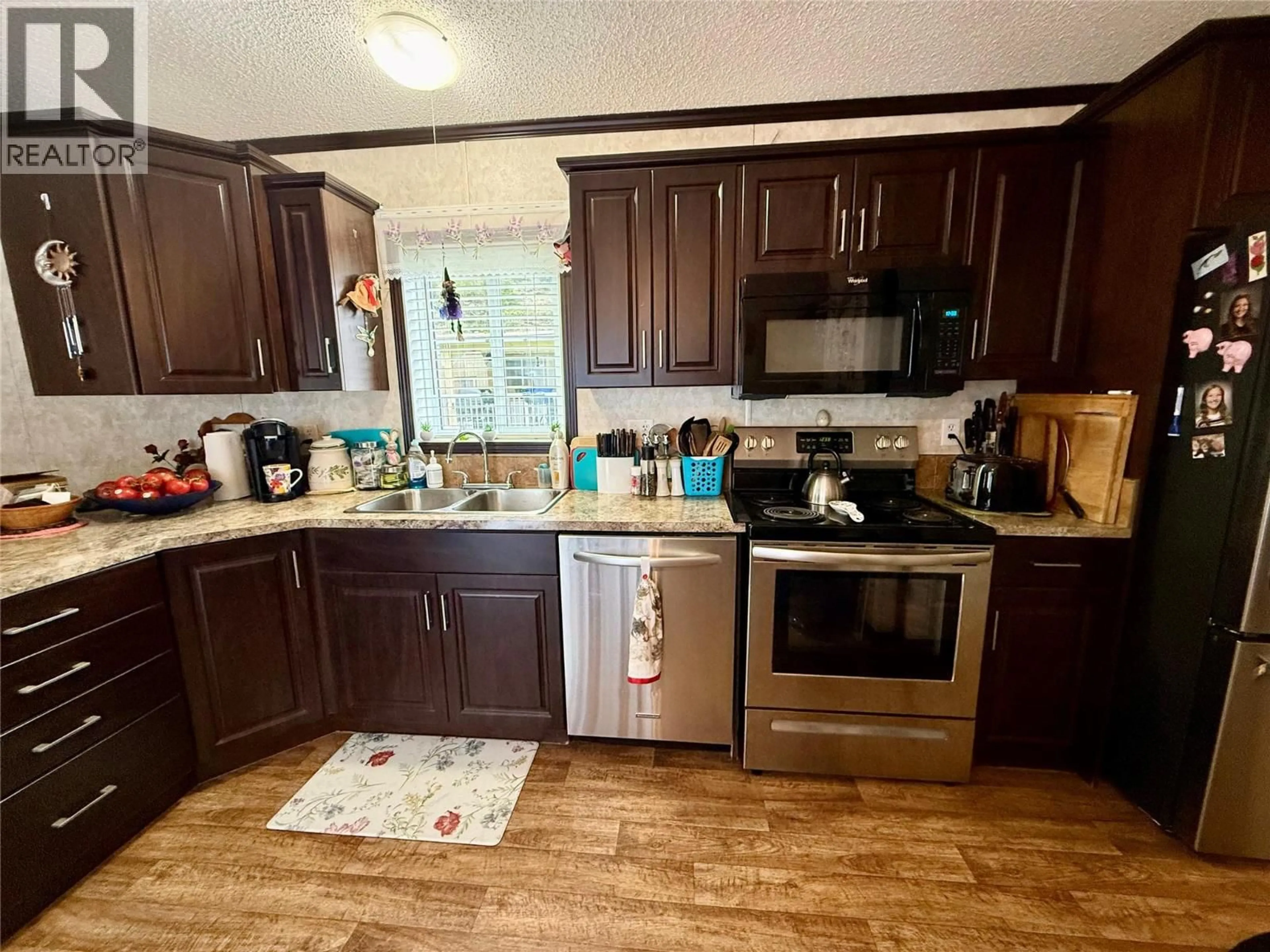 Standard kitchen, wood/laminate floor for 20 - 500 16TH AVENUE, Genelle British Columbia V0G1G0
