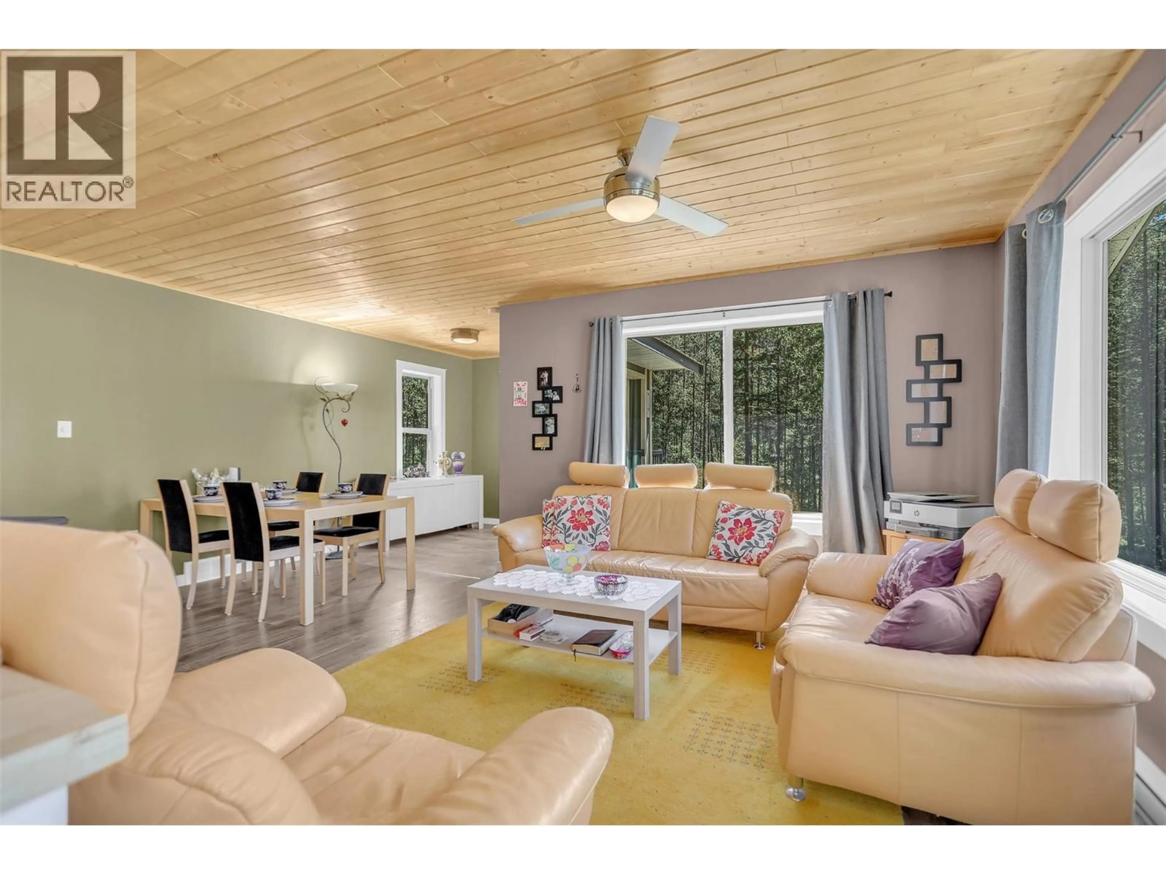 Living room with furniture, wood/laminate floor for 3445 BLYTHE-RHONE ROAD, Westbridge British Columbia V0H1Y0