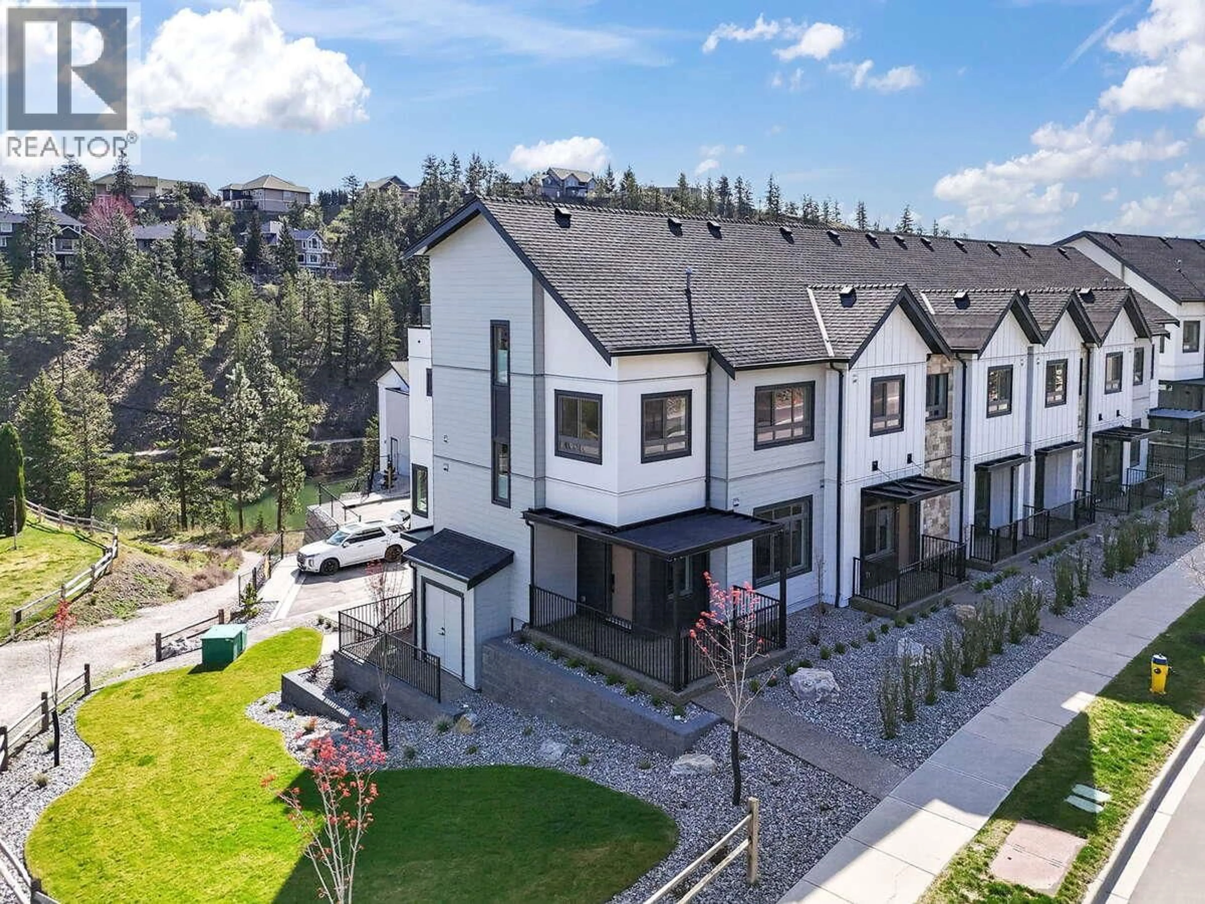 A pic from outside/outdoor area/front of a property/back of a property/a pic from drone, mountain view for 1 - 1550 UNION ROAD, Kelowna British Columbia V1V0G9