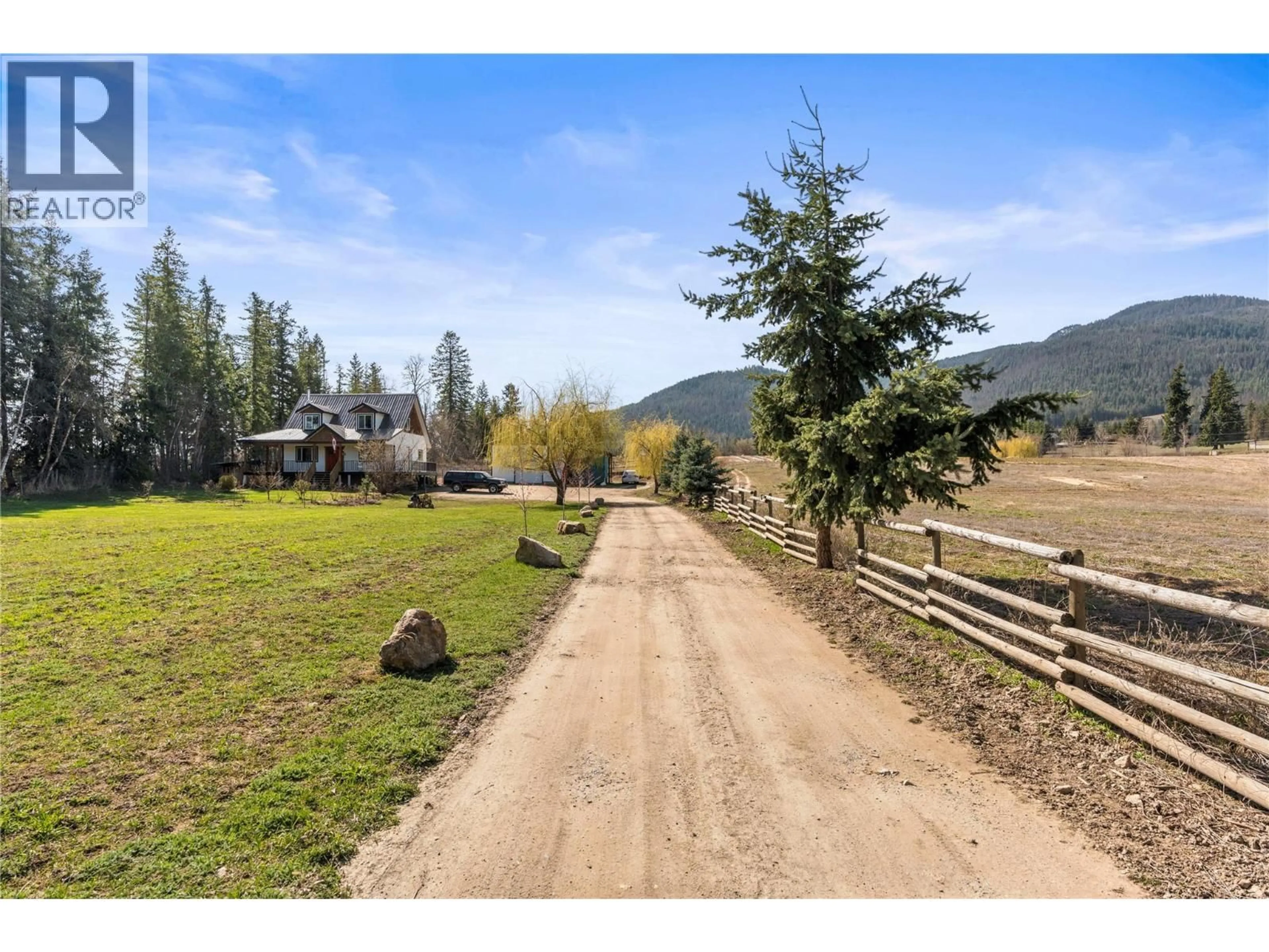 A pic from outside/outdoor area/front of a property/back of a property/a pic from drone, mountain view for 4150 20 AVENUE SOUTHEAST, Salmon Arm British Columbia V1E1X9