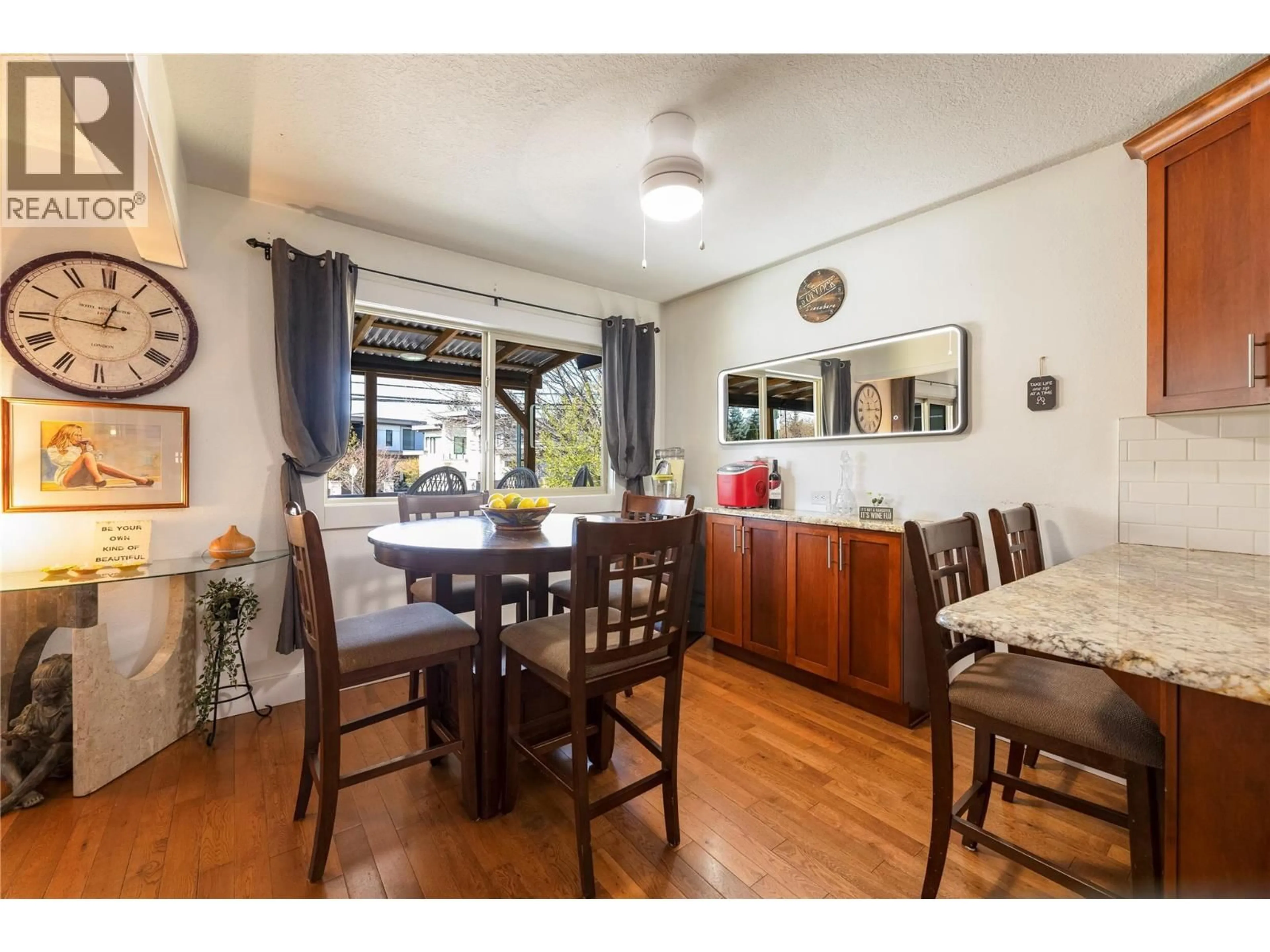 Dining room, wood/laminate floor for 4171 LAKESHORE ROAD, Kelowna British Columbia V1W1W1