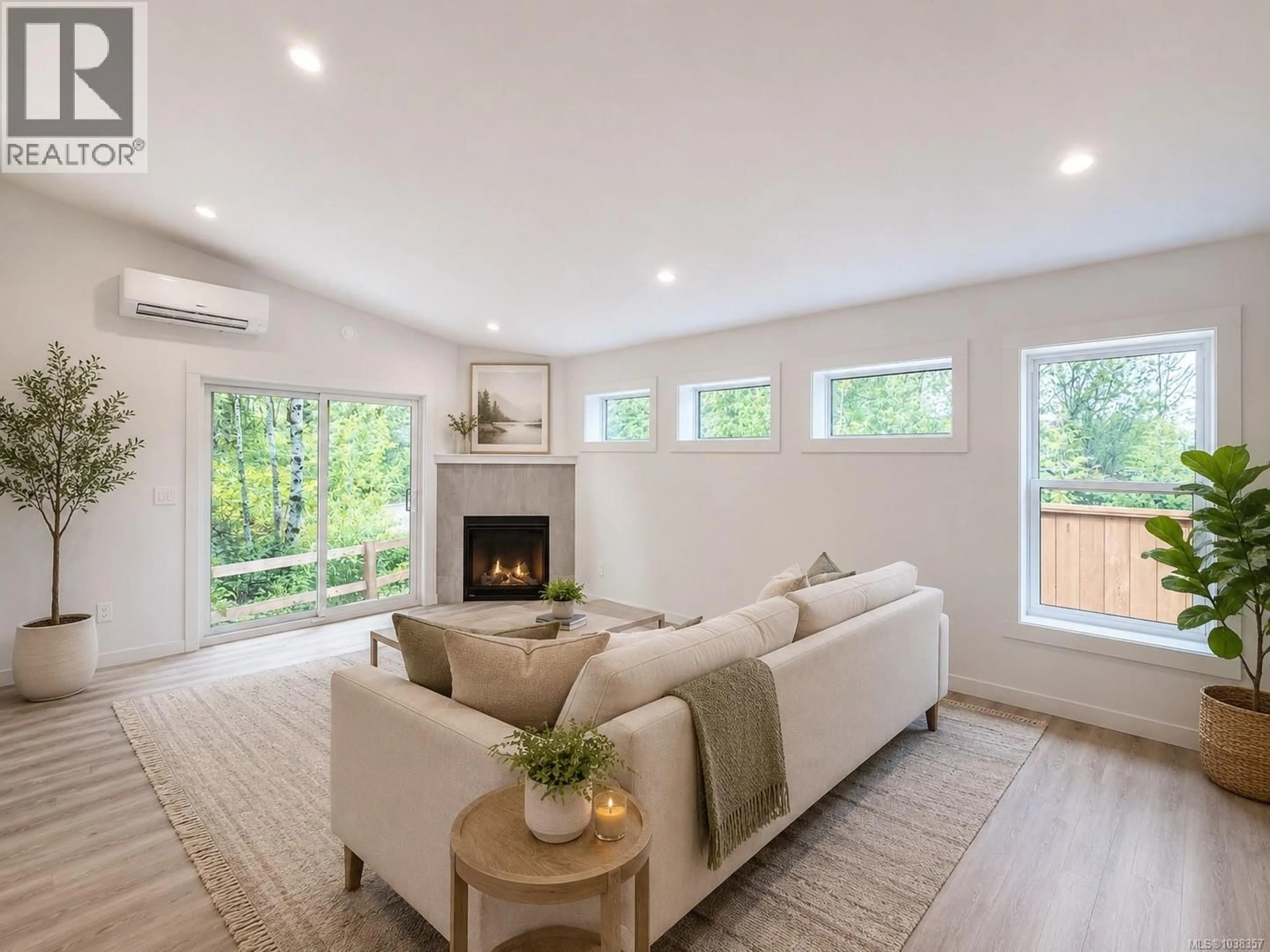 Living room with furniture, wood/laminate floor for 31 - 3025 ROYSTON ROAD, Cumberland British Columbia V0R1S0