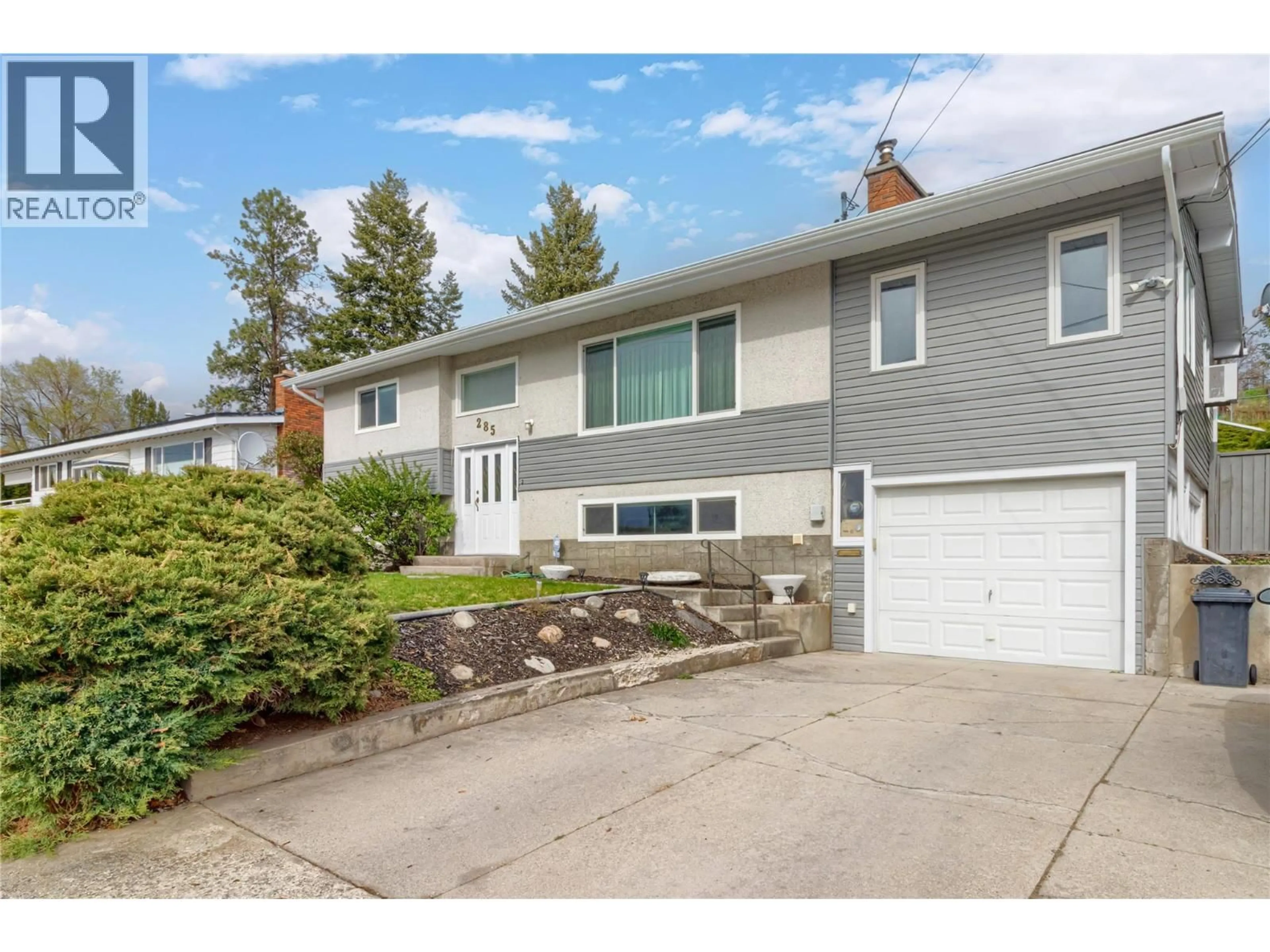 Home with vinyl exterior material, street for 285 DELL ROAD, Kelowna British Columbia V1X3P5