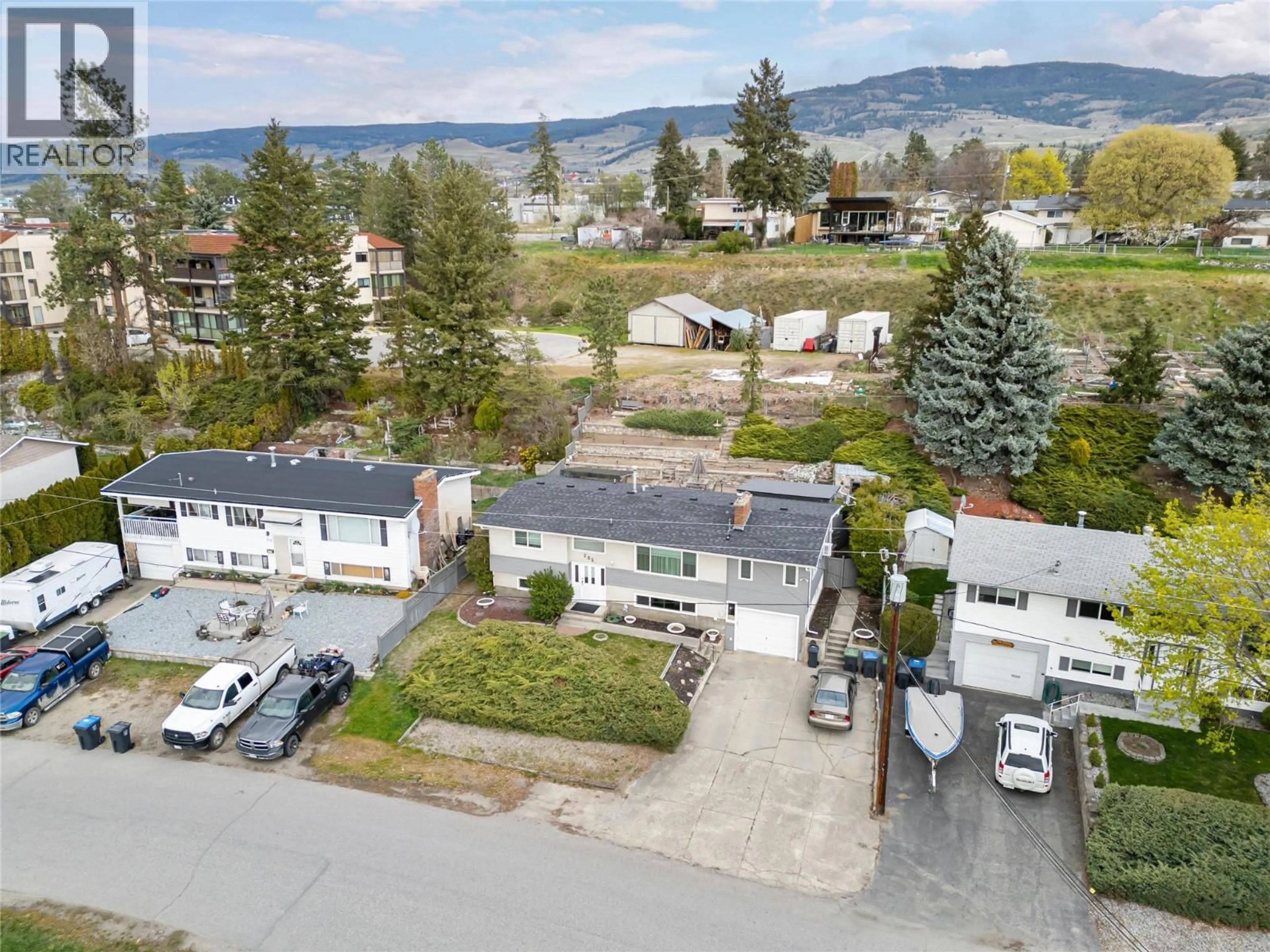 A pic from outside/outdoor area/front of a property/back of a property/a pic from drone, mountain view for 285 DELL ROAD, Kelowna British Columbia V1X3P5