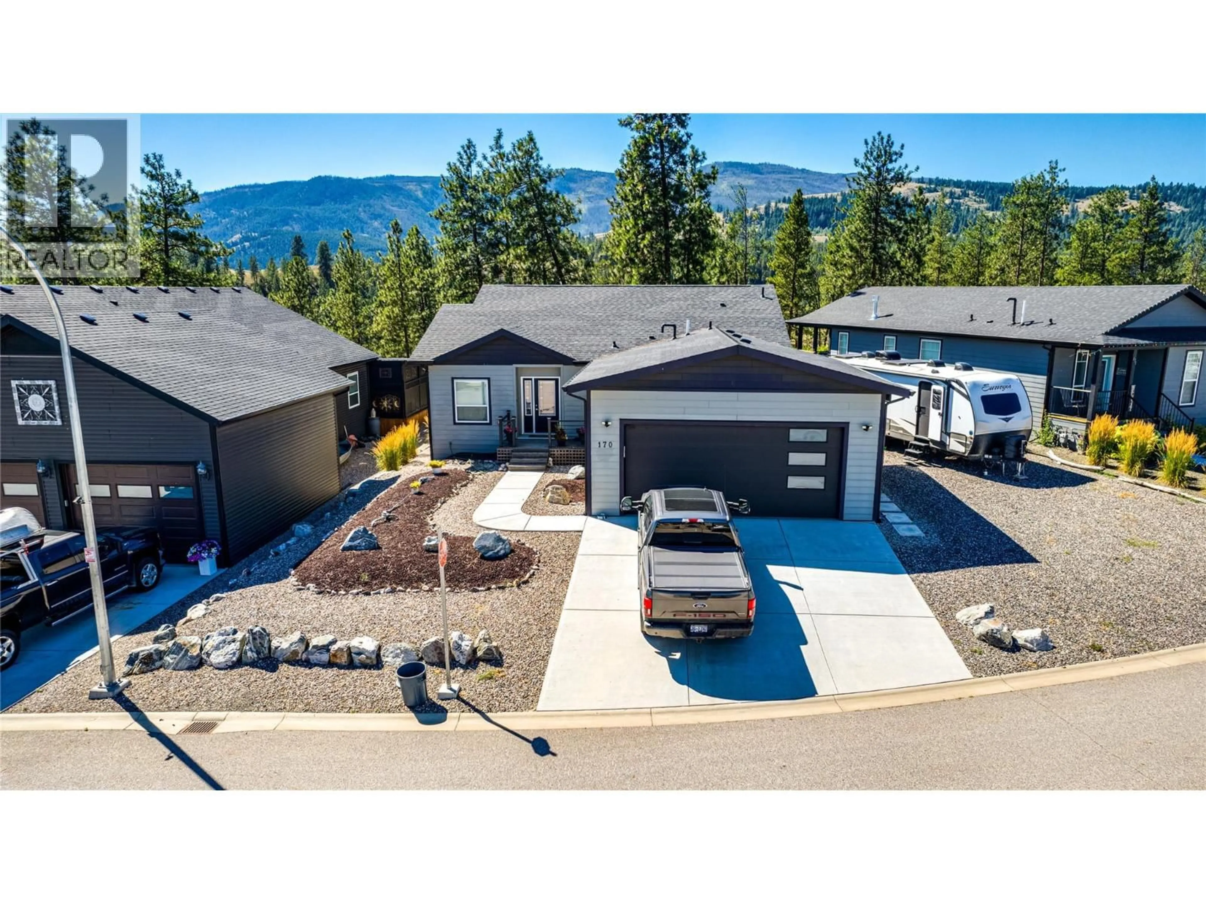 A pic from outside/outdoor area/front of a property/back of a property/a pic from drone, mountain view for 170 - 9510 HIGHWAY 97N OTHER, Vernon British Columbia V1H1R8
