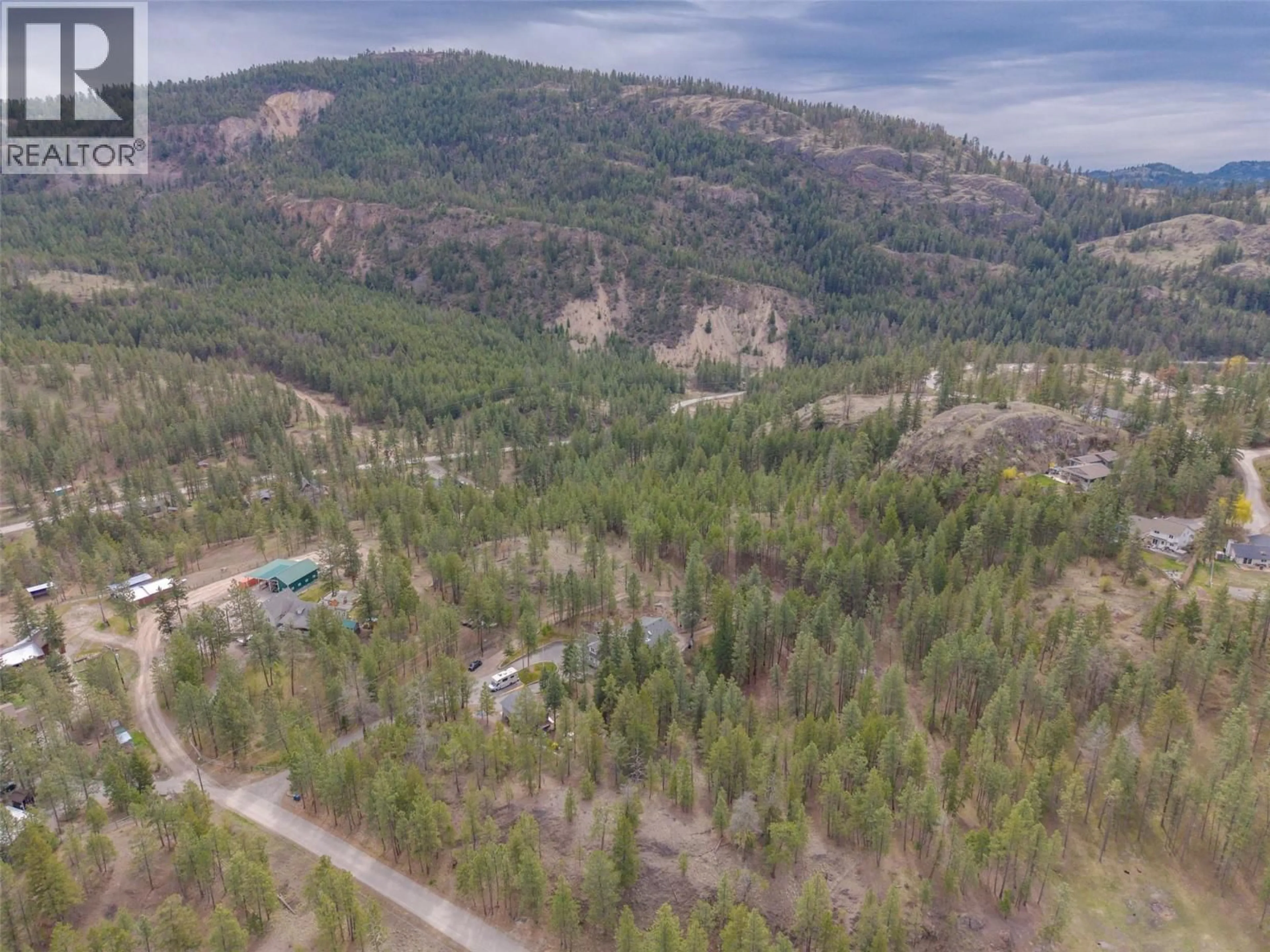 A pic from outside/outdoor area/front of a property/back of a property/a pic from drone, forest/trees view for 143 SADDLEHORN DRIVE, Kaleden British Columbia V0H1K0