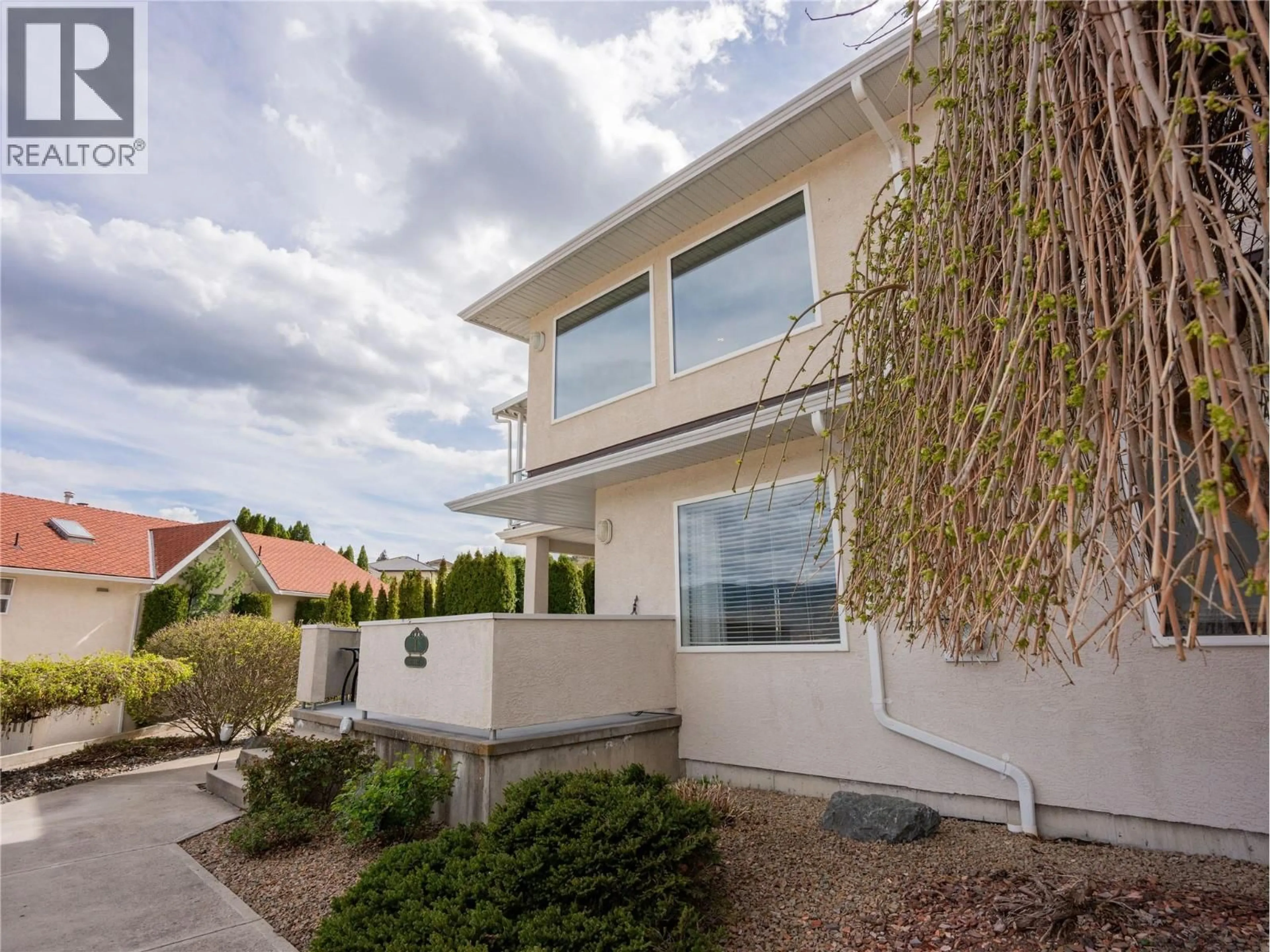 Home with vinyl exterior material, street for 8 - 12300 PINEHURST PLACE, Osoyoos British Columbia V0H1V4